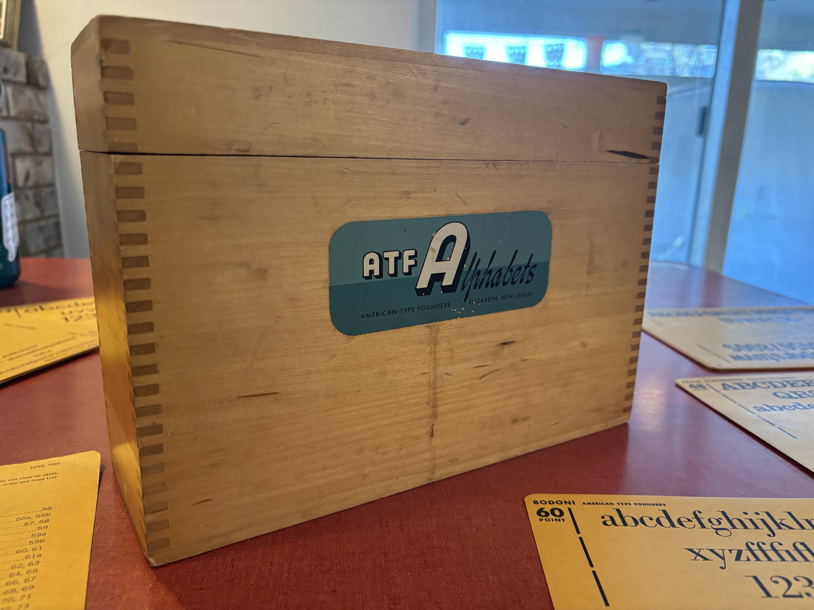 A wooden box with a sticker reading ATF Alphabets American Type Founders Elizabeth, New Jersey