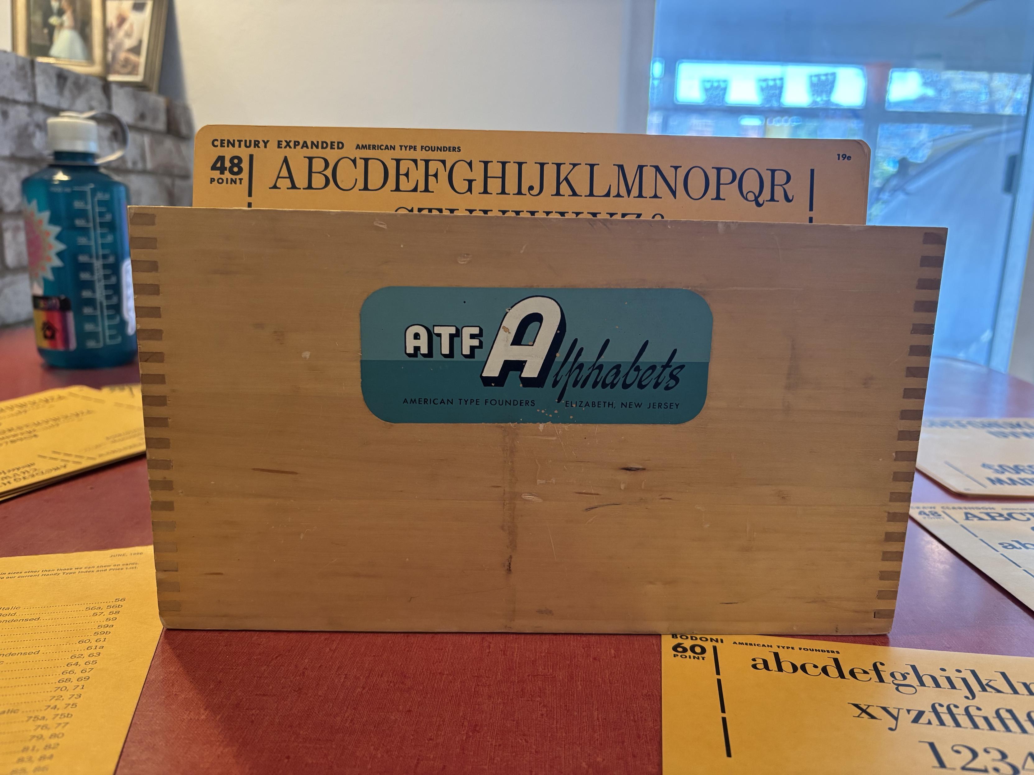 ATF specimen box open with Century Expanded typeface card visible inside