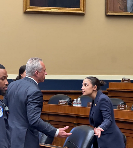 At today's Congressional hearing, RFK Jr is confronting AOC, who is giving him an incredulous look with her hands spread apart like "WTF is wrong with you?" We all wonder this.