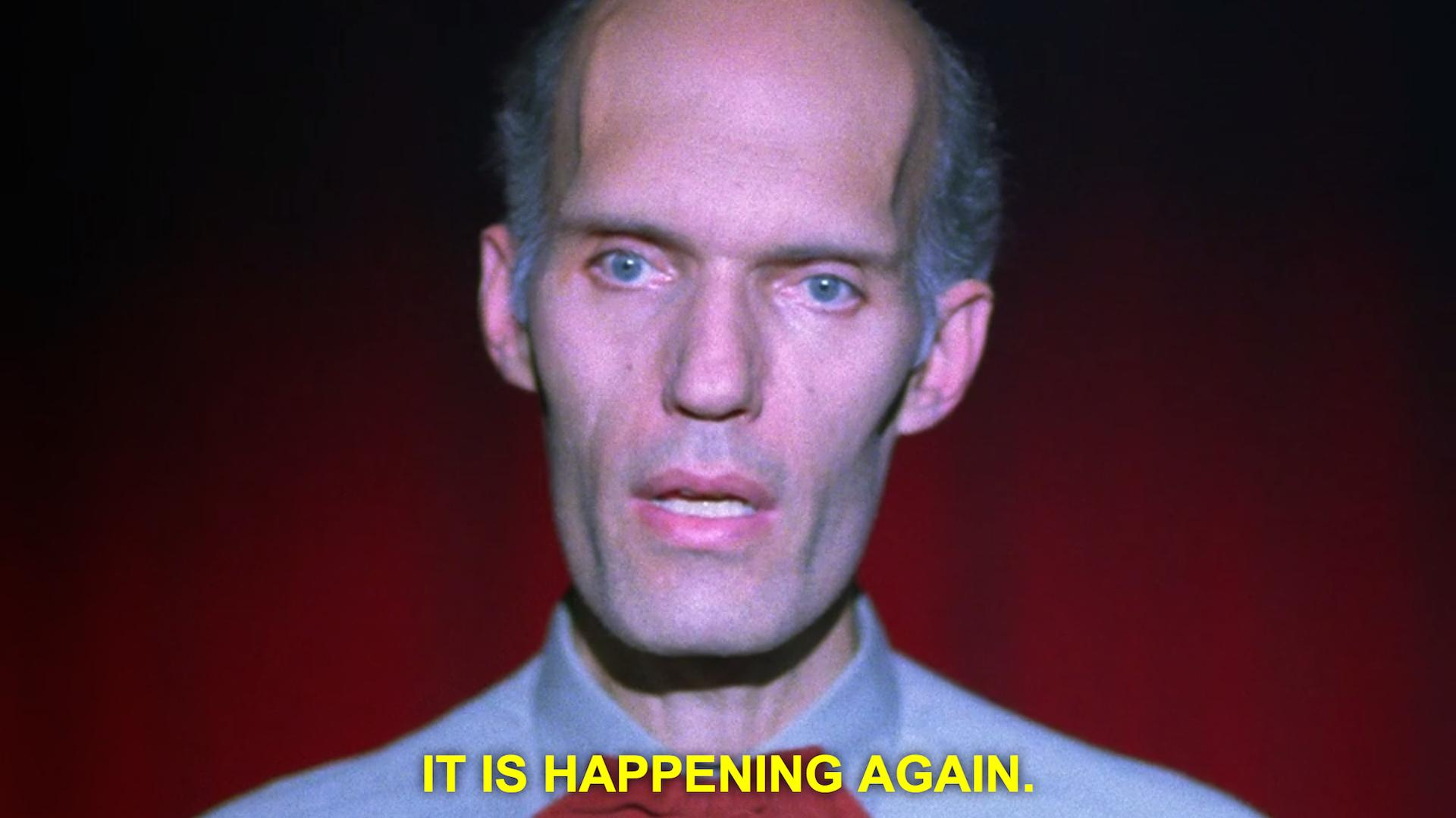 Screenshot from Twin Peaks S02E07, showing "Giant" (played by Carel Struycken) saying "It is happening again."