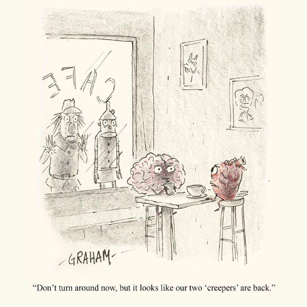 A cartoon illustration of a disembodied brain and heart sitting in a cafe while a scarecrow and tin man stare at them from the window. The heart says to the brain, "Don't turn around now, but it looks like our two 'creepers' are back."