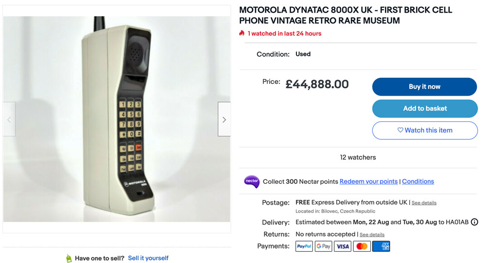 ebay listing of a dynatac. it's a proper brick, probably the first 'mobile' phone.