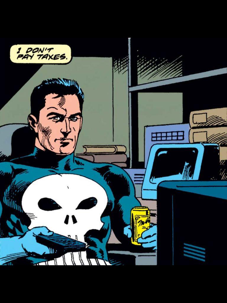 The Punisher sits in a warehouse hideout with a remote control pointing at the tv in one hand and a can of probably White Claw in the other. He narrates, "I don't pay taxes."