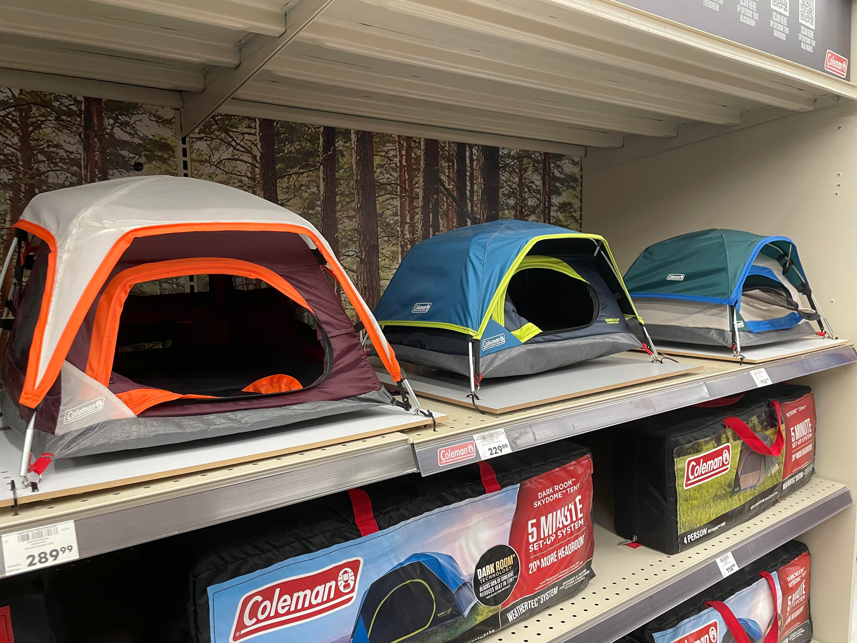 a store shelf with several "model" / "display" tents, which are scaled down miniatures of the full-sized tents that are actually being sold A cat or small dog could snuggly fit in there and be protected.  Or you could like.. use it to store your shoes/boots as well / protect from the elements.  Source: random picture from the Internet. If this is REI, I’m sorry I did not know. Please boycott them / support their worker strike.