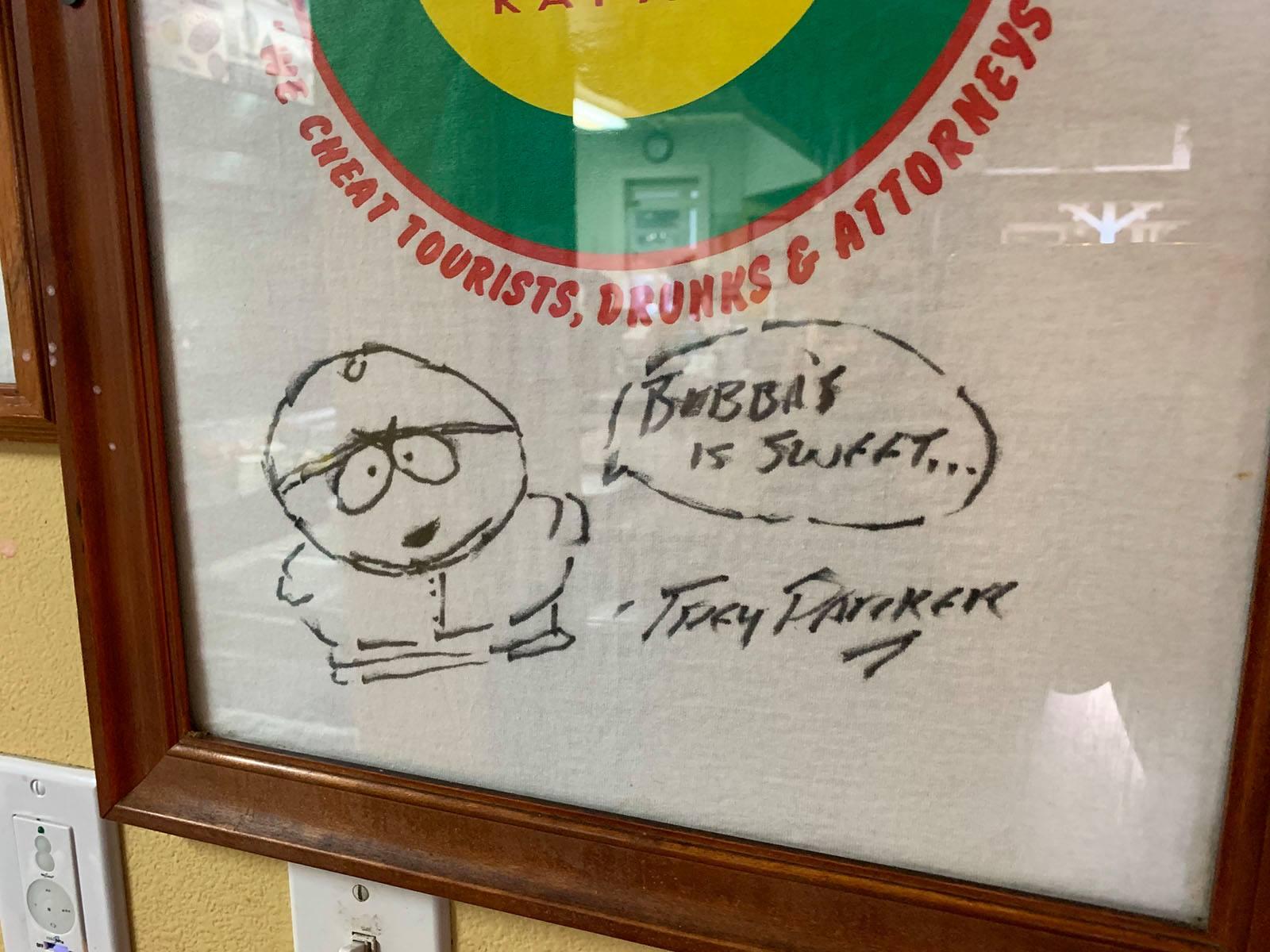 A signed t-shirt with Sharpie art of Cartman from South Park saying "Bubba's is sweet..."
