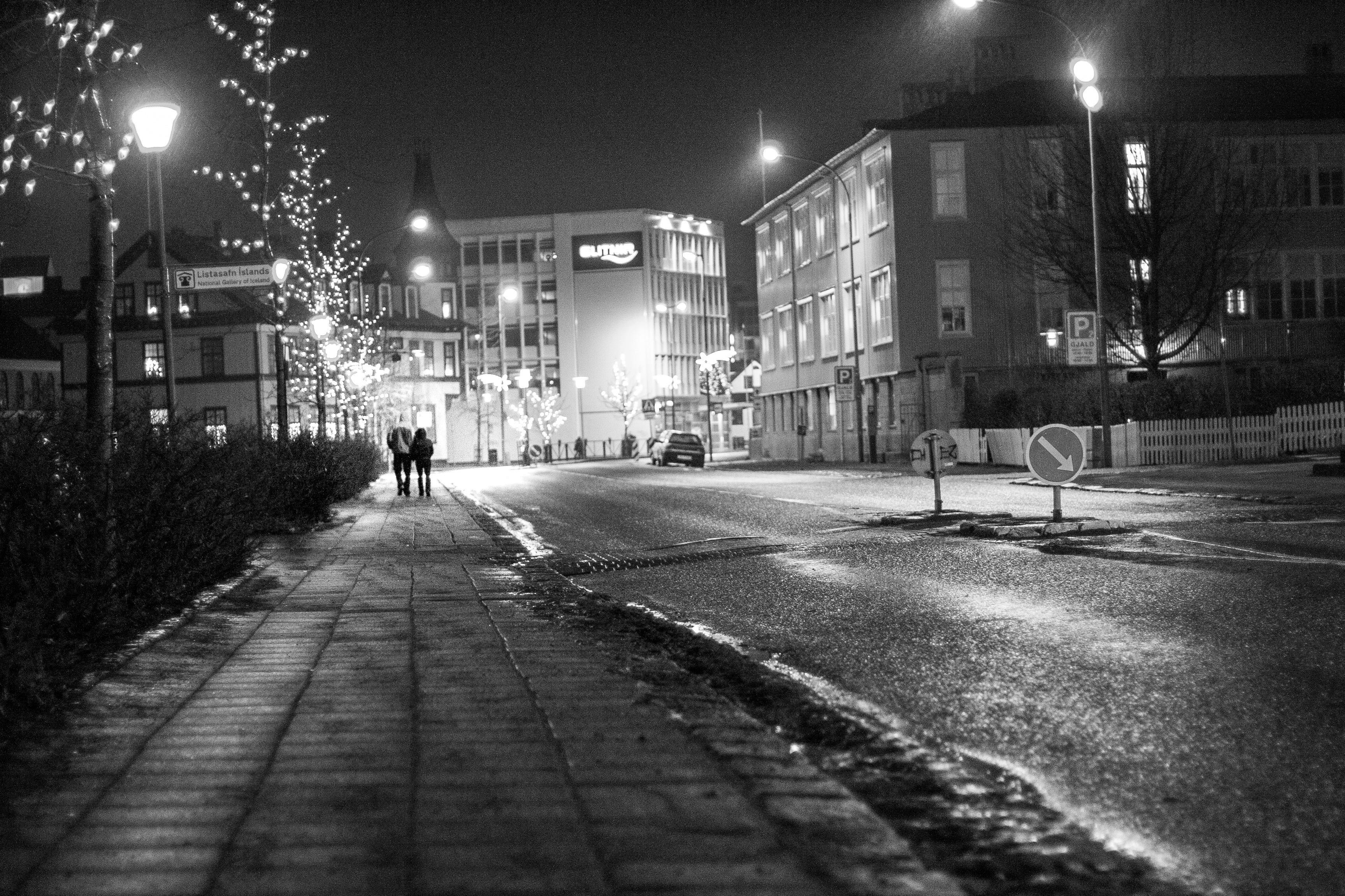 New year’s eve 2008 in Reykjavík city centre. A couple walks along the pond.