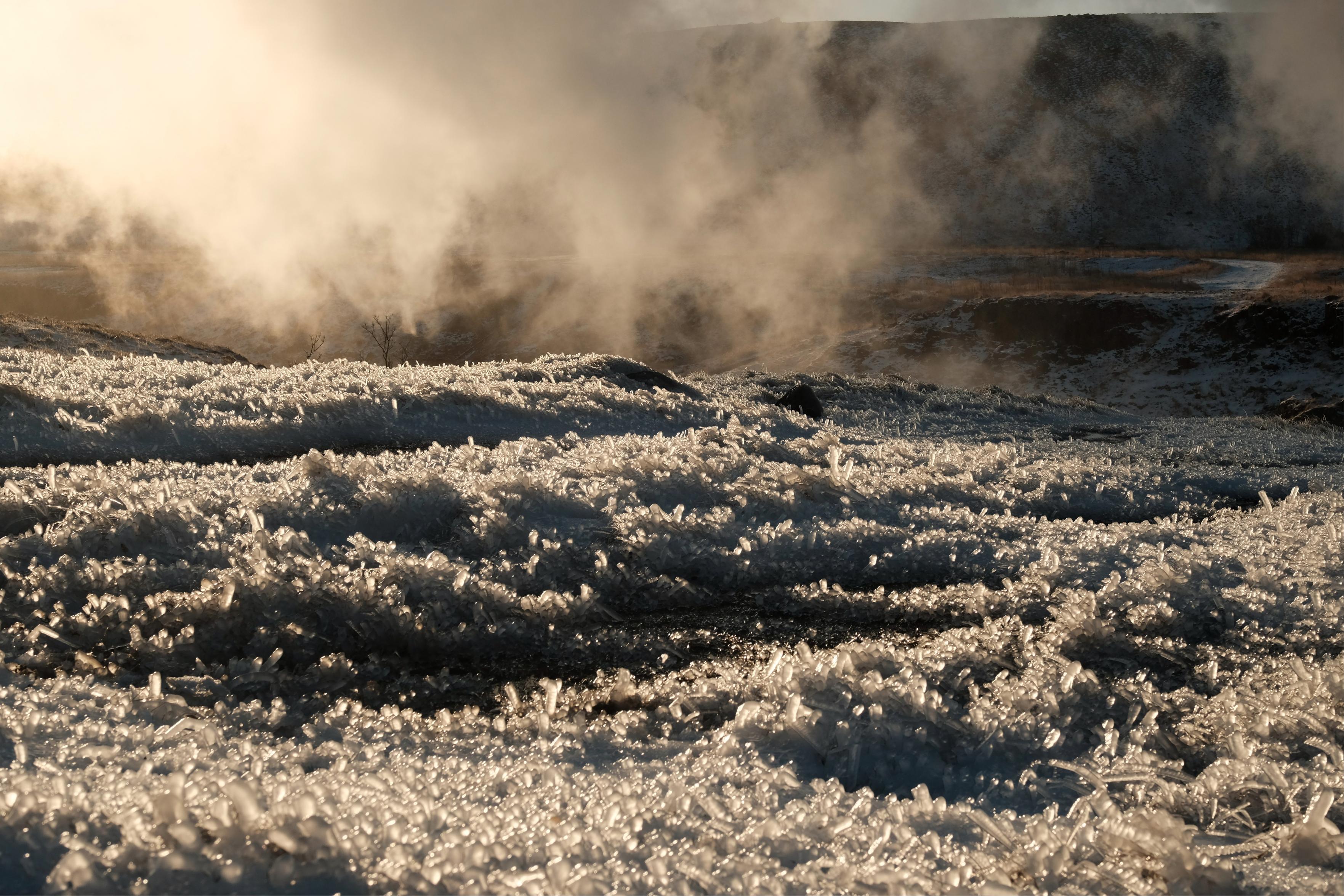 Steam freezes on the ground as crystals in Hveragerði.