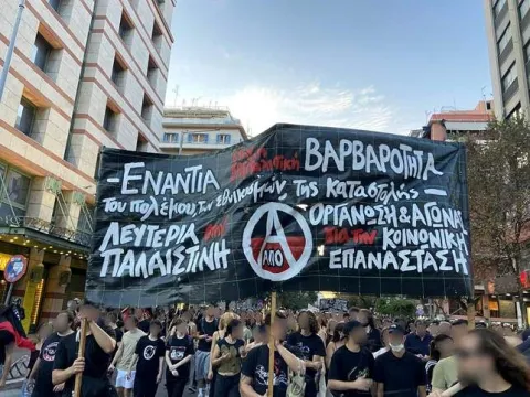 Interview with APO (Anarchist Political Organisation, Greece) at the IFA Congress

Interview with AΠΟ – Αναρχική Πολιτική Οργάνωση, Ομοσπονδία Συλλογικοτήτων – Anarchist Political Organisation – Federation of collectives (Greece), member of IFAby Ouzo, Fédération Anarchiste Marseille – groupe OaïOuzo (FA) : Morning comrades, this interview follows the 13th Congress of IFA which you organised here in Athenes. Can you share with us the story of your organisation that is 10 years old this year ? From which political context it emerged? How are you organised as a federation ?APO :The Anarchist Political Organization – Federation of Collectives (APO), was founded as a federalist organization active in Greece since 2015 and a member of the International Federation of Anarchist Associations (IFA). Currently, three anarchist collectives participate in APO, two from Athens, the anarchist collective Circle of Fire and the anarchist collective Omicron72 and one from Thessaloniki, the collective for social anarchism Black and Red. The collectives & groups are active also through their own squats and self-organized structures. More specifically, the collective Circle of Fire through the squat Lelas Karagianni 37 (founded in 1988) & the collective Omikron.72 through the anarchist – antiauthoritarian center Antipnoia (founded in 2007), the collective Black and Red though the libertarian center No Pasaran (founded in 2023, after the eviction of anarchist squat Mundo Nuevo, which founded in 2015). The autonomous action of the collectives in the cities in which each of them is active and their participation in local actions, processes and projects contribute in the direction of common goals and strategies that emerge within the common project of APO.APO is organized as a federation with its collectives being its cells, co-operating in a horizontal structure. It is constituted on coherent and adequate political agreements between anarchist collectives that shape their unified movement on a nationwide level through collective procedures in which they coexist equally. Since December 2015, A.P.O. publishes the anarchist newspaper Γη και Ελευθερία (in English Land and Freedom) and since December 2020 operates the website of libertarian counter-info Land and Freedom. Since 2017, we formed a specific thematic group against patriarchy by the women comrades of the groups and collectives of A.P.O. and has a stable and constant presence in the struggles against the state-capitalistic-patriarchic authoritarian system.A.P.O. is structured on common political beliefs, principles and positions and aims to acquire more and more coherent political agreements in order to be able to formulate long-term strategies of struggle. It seeks to spread the proposals of the anarchist struggle in the movement and society and to form consciences. To contribute in this way, for its part, to the creation of a coherent, radical movement. A movement that will put a stop to any attempt to manipulate, hijack and mediate social and class struggles and to integrate them by reformism. A movement that will clearly promote social revolution as the only realistic way to their final liberation of the people from below from domination and will connect the partial struggles to the overall revolutionary target of overthrowing the state and capital.The creation of the Anarchist Political Organization – Federation of Collectives ten years ago, is a political and organizational intersection of our functioning and action so far. This choice encapsulates conclusions and experiences from the struggles of yesterday as it is a product of critique and self-criticism while opening new perspectives for the transition from protest and rebellion to the ongoing struggle for social revolution. A.P.O. is the child of the social and class riots of December 2008 (taking under consideration the possibilities and also the limitations that were brought about) and of the great mobilization in 2010-2012. We are inspired by the libertarian movement of CNT-FAI, that through tough struggles, riots and mostly the class, social, political organization managed to make into practice the idea of general subversion of the state and capitalism and the development of social self-management.Ouzo (FA) : Thank you for this. I know that you are involved in many struggles, the students, the squat, palestine, trials support… How do you manage to impose your anarchist agenda within these struggles that are too often co-opted by authoritarians, Marxist, leftists… ?APO :For us, A.P.O. is the vehicle of struggle for our constant and consistent intervention in the battles of the social and class war, from the struggles against class exploitation, state repression, fascism and war, against the plunder of nature, against patriarchy and gender violence to the struggles for the defense of public spaces, of the public character of education and health care and the struggles in solidarity with refugees and immigrants and political prisoners. For the more effective diffusion of the anarchist vision of a society of equality, justice, freedom and solidarity, for social and class emancipation, for the organization of the struggle for social revolution and the creation of a bridge between everyday struggle and the vision of anarchy and libertarian communism.We seek to participate and intervene continuously and actively in the social and class struggles that are antagonistic to the state-capitalist plans, with the aim of radicalizing their content, the processes that frame them and the means of struggle. To interact with social and class projects, in every field of social life, in the workplaces, in schools, universities, neighborhoods, promoting the development of unmediated, anti-hierarchical and anti-institutional struggles.Within these fields, we are constantly in confrontation with reformism, a perception antagonistic to the revolutionary perspective. Its actors – whether they come from the forces of the parliamentary left, or from the bureaucratic trade union leaderships or from extra-parliamentary bodies and alternative organizations – systematically attempt to mediate social and class struggles and their people, through the assignment of initiatives to experts, thus limiting the scope and forms of the struggle, and ultimately leading to denervation, their distortion and slander.Therefore, it is our constant concern to fight against these reformist logics and perceptions within the struggles and to be constantly awake to prevent attempts to assimilate social and class resistances. Our distinct participation in the open processes of social and class struggle, with full respect for their autonomy, allows us to defend the self-organization and the unconstrained participation of all people in them and the choice of the means of struggle according to their capabilities. Through this vital interaction and the continuous enrichment of our political experiences, we constantly update our political discourse regarding the situation and the prospects of the social and class struggles today. At the same time, we promote the formation of stable structures of resistance in every social and class field, seeking to disseminate our anarchist positions and proposals, not only in the direction of highlighting the limitations of the partial struggles in the present, but promoting their continuous radicalization and connection with the overall prospect of Social Revolution.
Ouzo : How do you feel about IFA after this congress you organised ? Meeting each others was a strong moment of international anarchist cooperation. What are your perspectives as a federation within the IFA ?
APO :At this point we would like to say that we have not completed our assessment as APO for the Congress of the International of Anarchist Federations that took place in early April 2026 in Athens. This process will be completed in the immediate future, where we have scheduled our organizations Congress in early June 2026. For our part, however, we can submit a preliminary conclusions of this process, which we believe moved in a positive and productive context towards producing an international position on issues such as the intensification of state and capitalist brutality, the threat of generalization of war, fascism and internationalist solidarity among the oppressed, while offered interesting exchanges of experiences on the intensification of patriarchal violence and the plundering of nature and local peoples worldwide. We hope that this positive direction will continue, with joint agreements on additional issues and with initiatives that will have the horizon of strengthening anarchist positions, discourse and action.Especially in a period where military operations are expanding abroad and state repression is intensifying at home, we believe that the need for the anarchist movement to be able to form its political value and ideological framework is even more acute, both to influence the consciences of those from below and to defend its positions against the attempts to impose foreign perceptions of the anarchist struggle and the internationalist struggle solidarity. On the one hand, the very dynamics of the changes and overthrows sought by the rulers require the rapid reconstruction of the current at an international level, the urgent need to expand the network of contacts and communication of anarchists at an international level is proven, with the main aim of exchanging experiences, informing about how authoritarian politics is shaped in every geography and the social resistances that are manifested in every part of the planet. In addition, the debate at the international level on the war treaty and the generalized threat of war is crucial.It is literally a matter of life and death both for the movement and for societies and the oppressed, to be able to form and adopt as coherent as possible a stance amongst anarchists towards militarism, the threat of war and resistance to world domination. We believe that this can be achieved if the comrades in every geography manage to realize that as long as there are visible historical, political, social or even cultural differences between the individual societies (and therefore the movements) that are necessarily formed under the shadow of the nation state, which must be respected, at the same time todays anarchist analysis ascertains a single state and capitalist condition that dominates and oppresses the entire planet. The deepening of the relevant debate and the corresponding cooperation of anarchists at an international level are basic prerequisites for the strengthening of the anarchist struggle, that is, the strengthening of the very social and class resistances that can protect societies from the threat of war and the intensification of exploitation and oppression.Ouzo : Efcharisto para poli sidrofoi. Do you have something else to say ? A slogan to share ?Thank you very much for this interview and we send our solidarity to the comrades all over the world who are fighting in every corner of the earth for a society of Equals, without exploitation and oppression, without masters and slaves, for the new world that we carry in our hearts!As a closure, we will borrow a phrase from the indigenous Mapuche: MARICHIWEU! (We will win a thousand times)Long live Anarchy!source: IFA



#anarchism #europe #greece #resistance