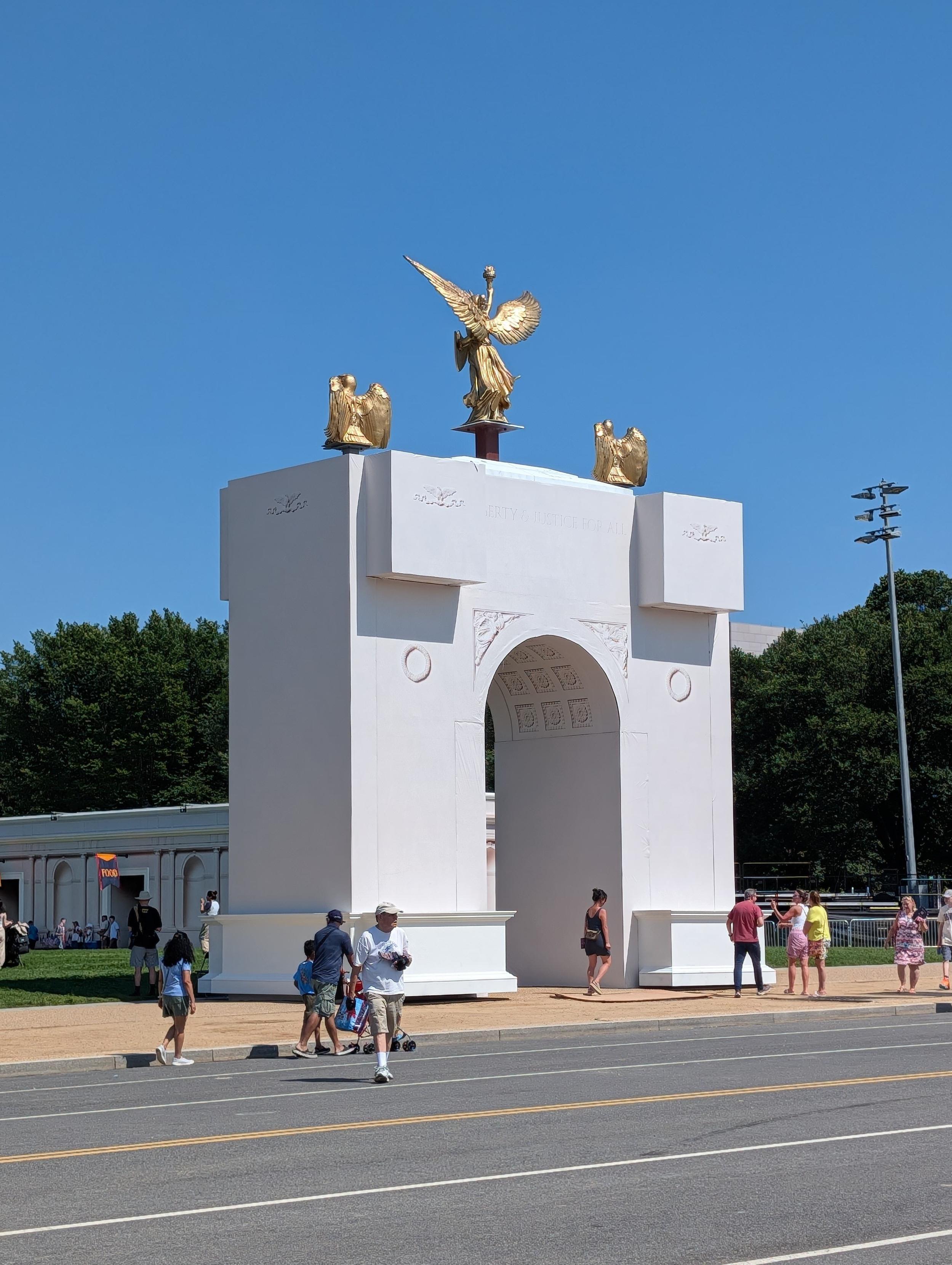 A white, blocky scale model of the arch Trumps wants to build. It ugly.