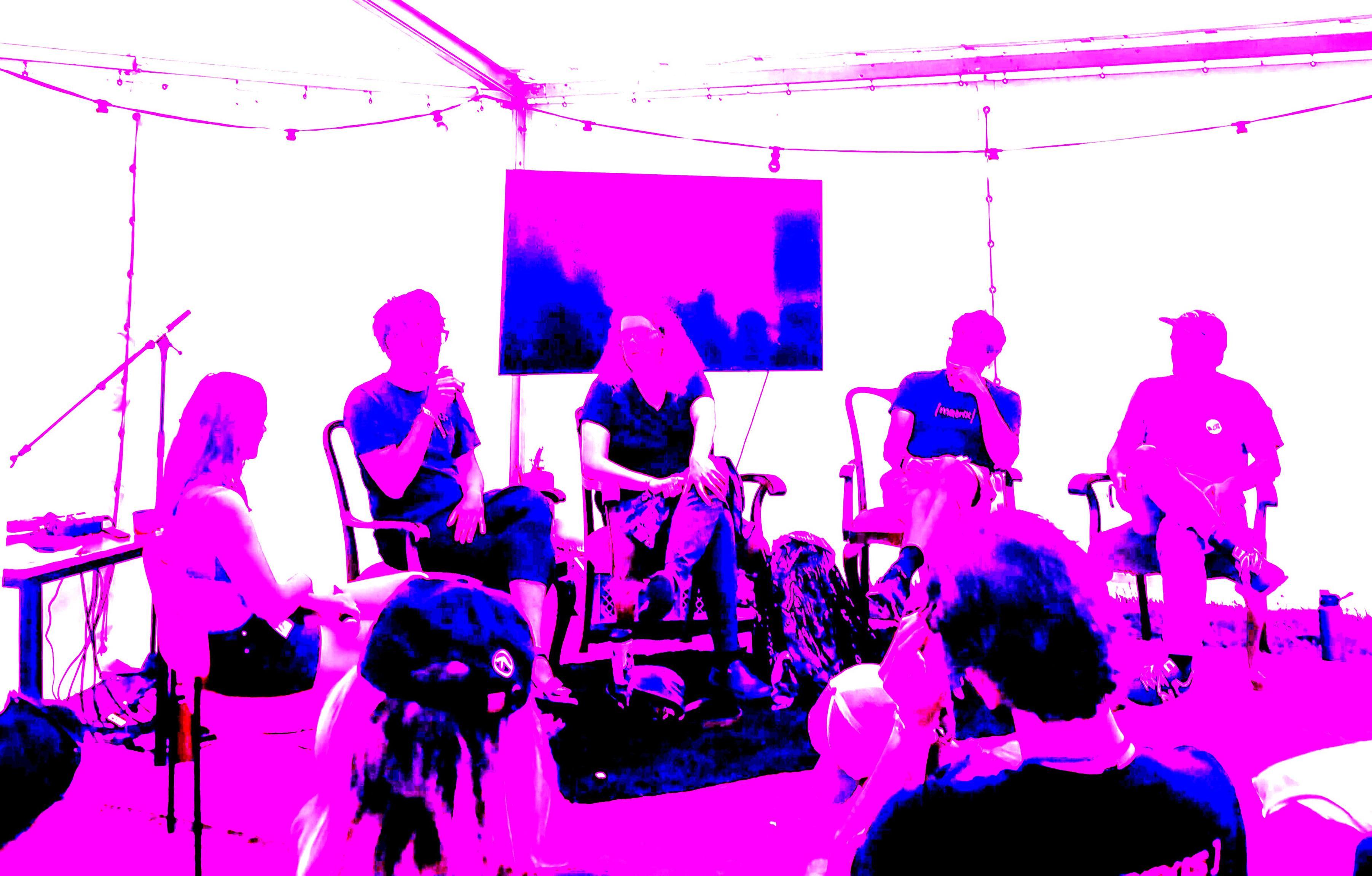 A photo that is edited to be very pink so you can't see anyones facial details