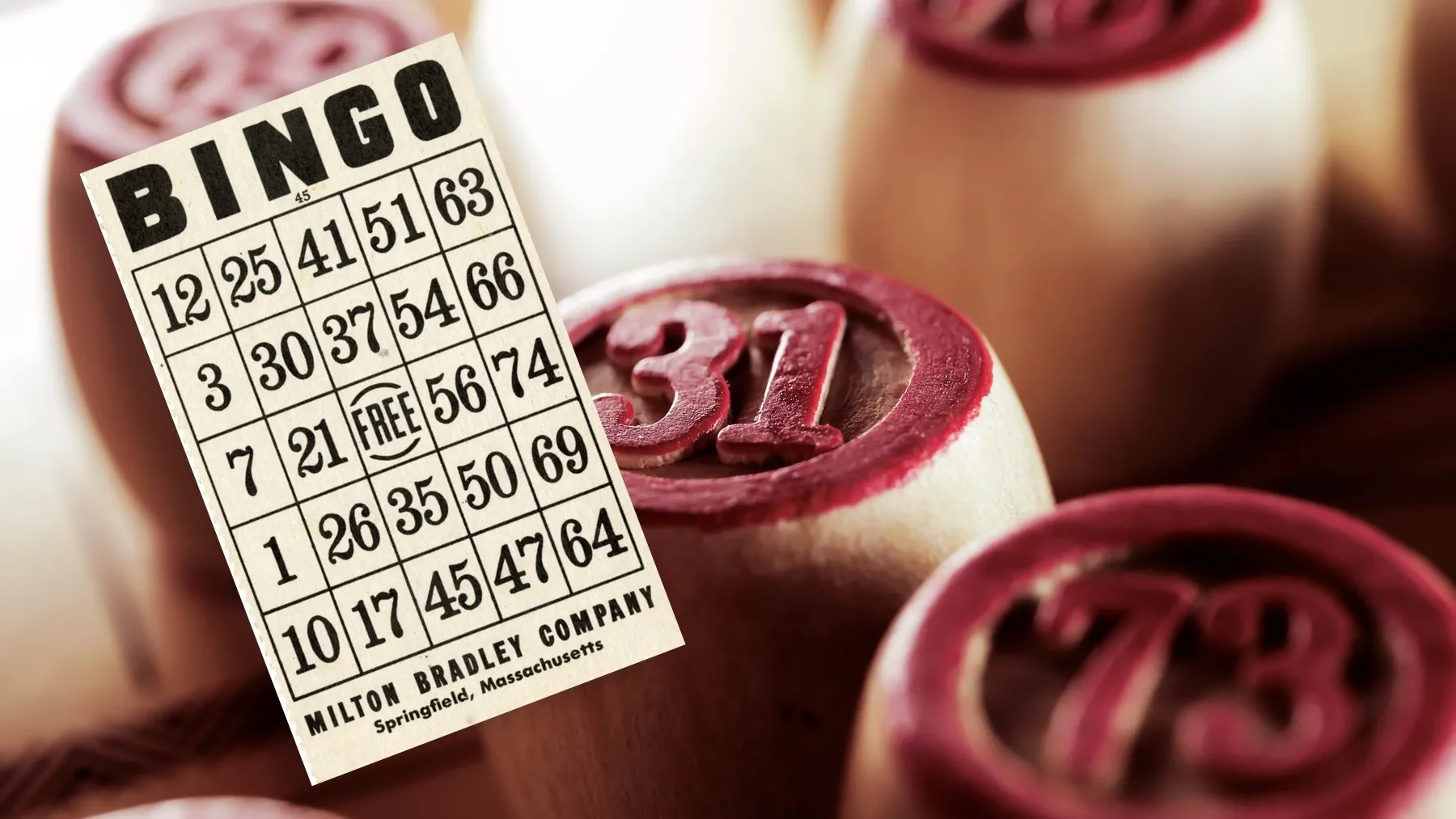 Illustrative stock imagery of a bingo card and bingo player stamps.
