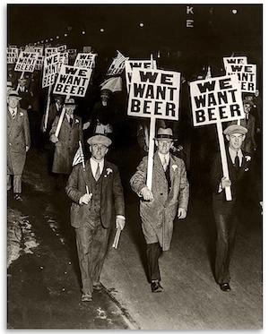 protesters with "we want beer" signs