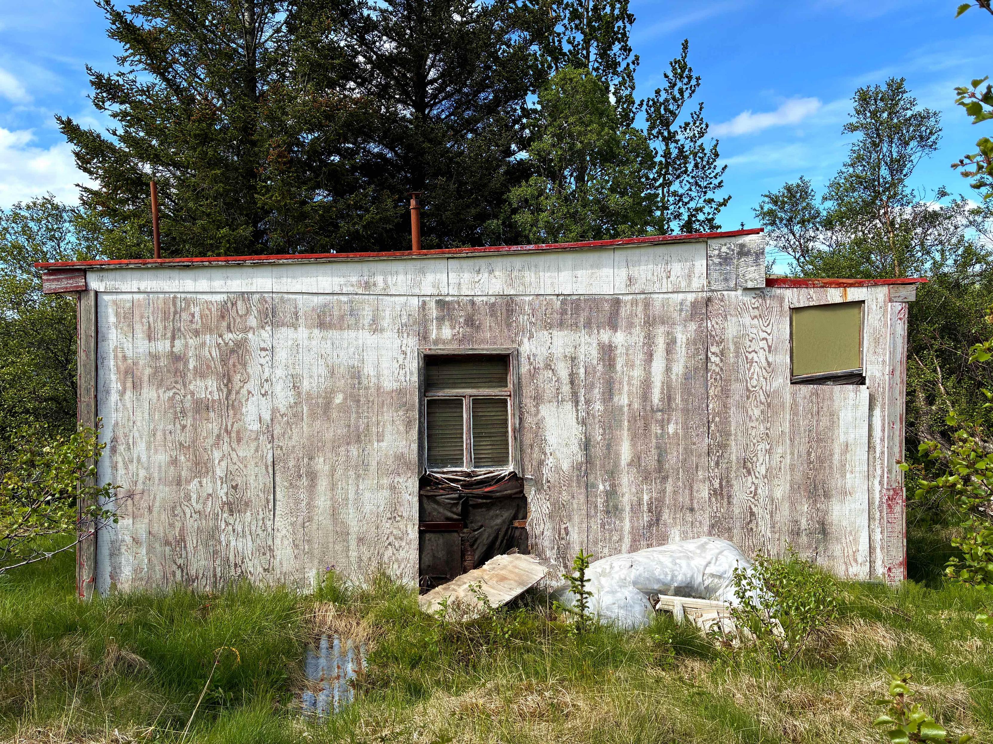 The back of an abandoned cabin.