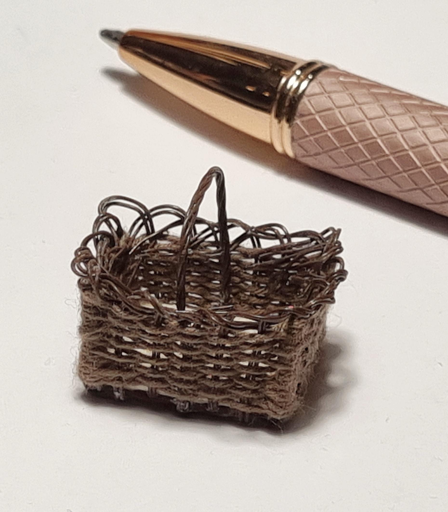 Tiny basket and pen for size reference.