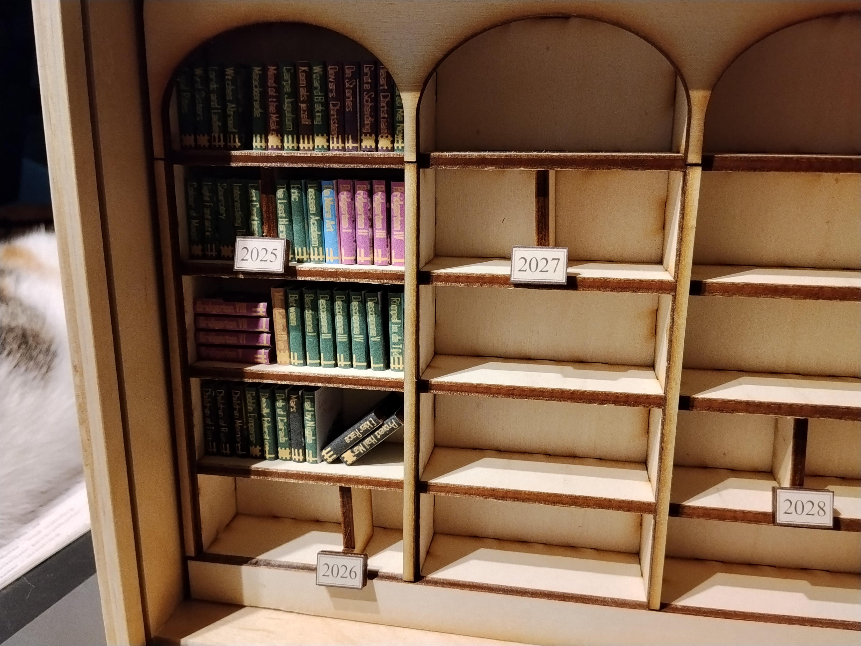 Close up of the library. Every book has a title and rating (in bars)