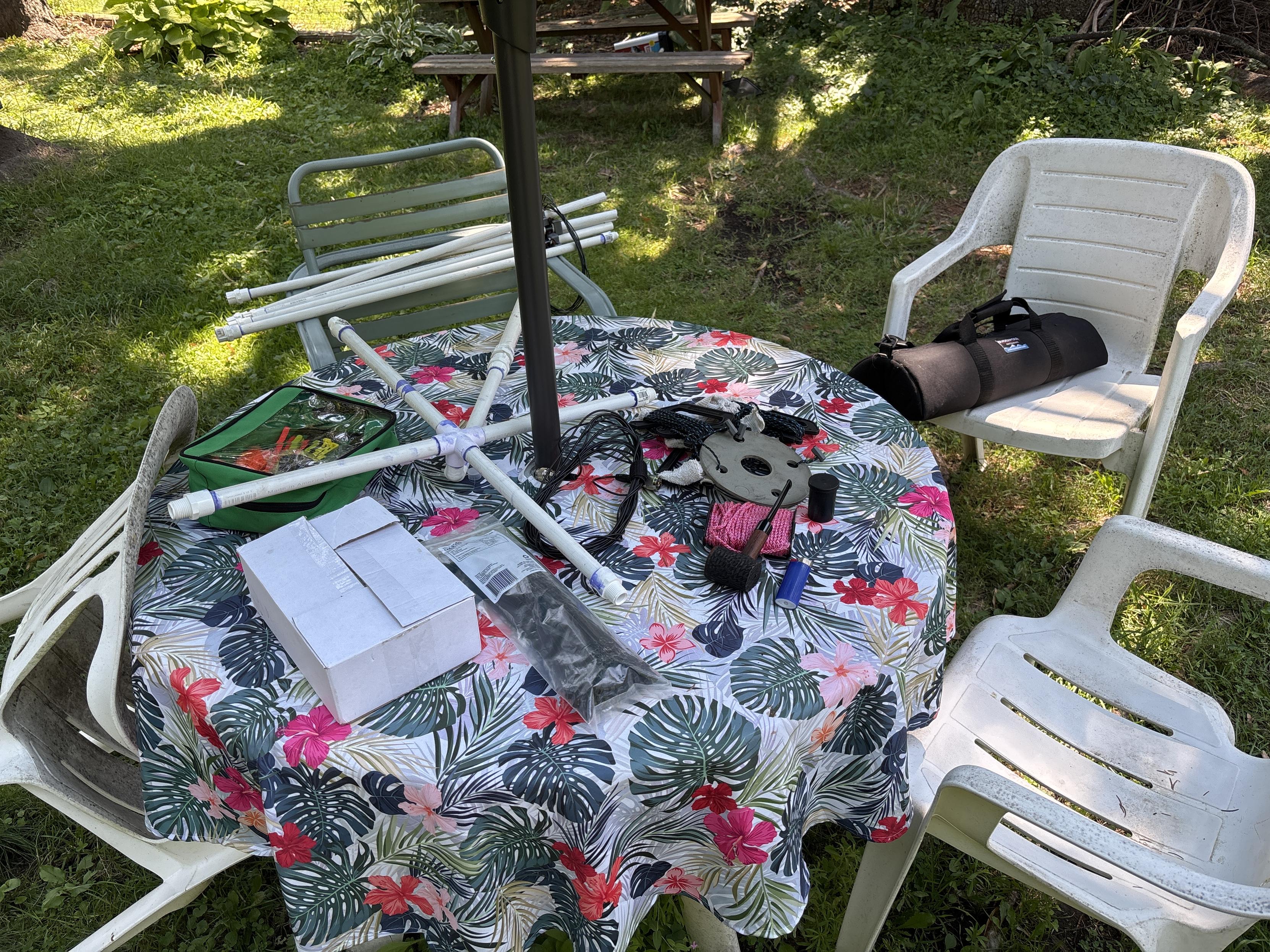 pieces of the antenna on a backyard table
