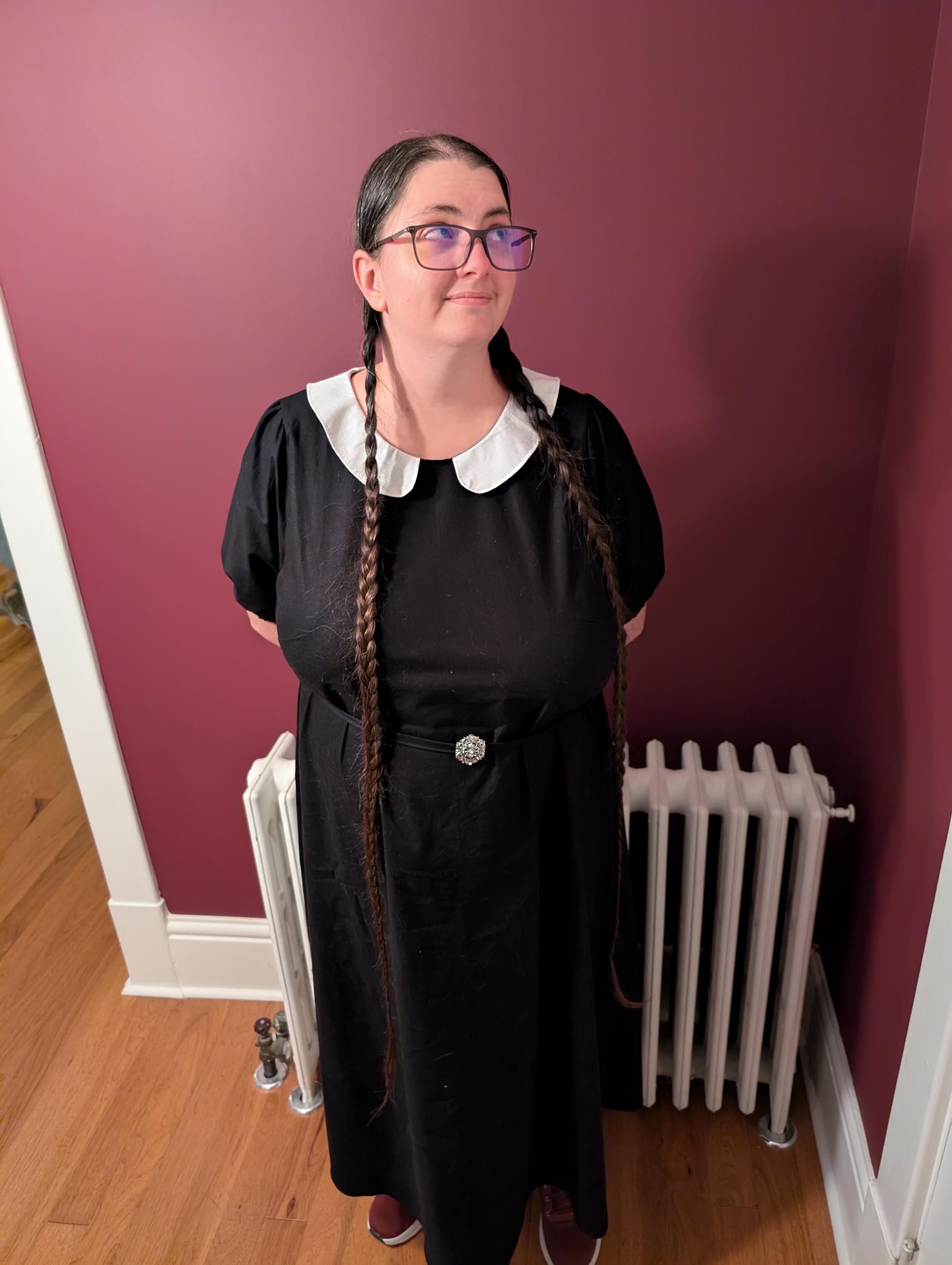 Full view of Morgan in her Wednesday Addams dress (with full pigtails)