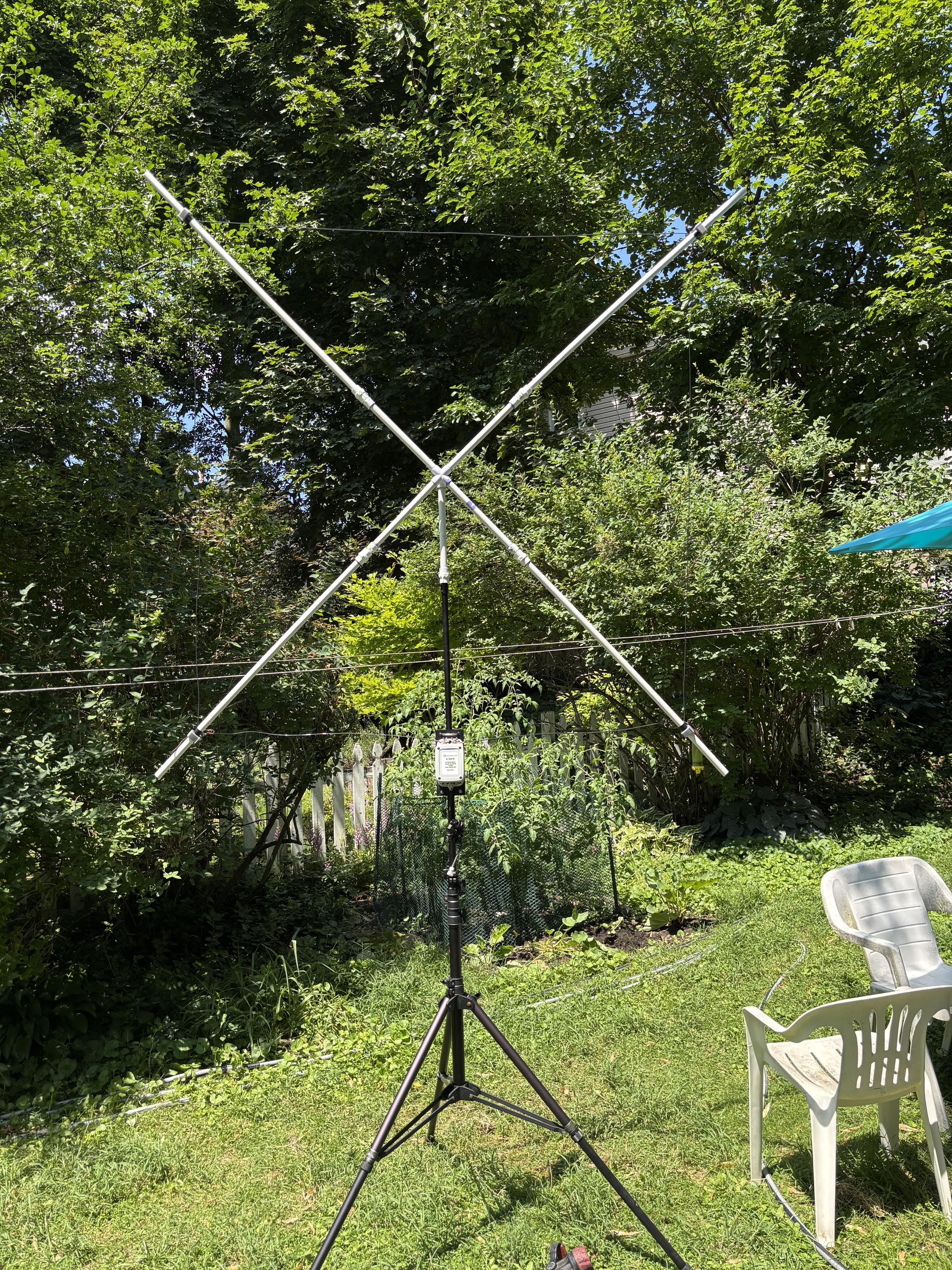PVC and #14 THNN wire quad loop full wavelength antenna for the 6 meter band, with RFI choke and current balun on tripod before raising mast