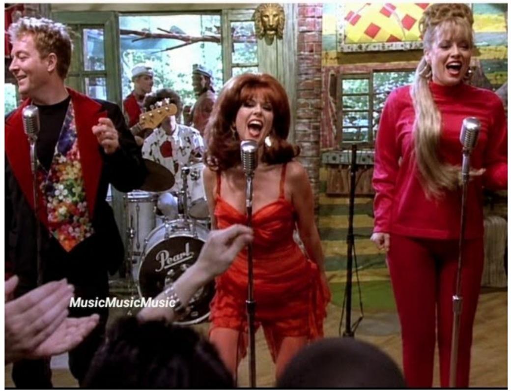 A still of the video from Love Shack by the B-52s