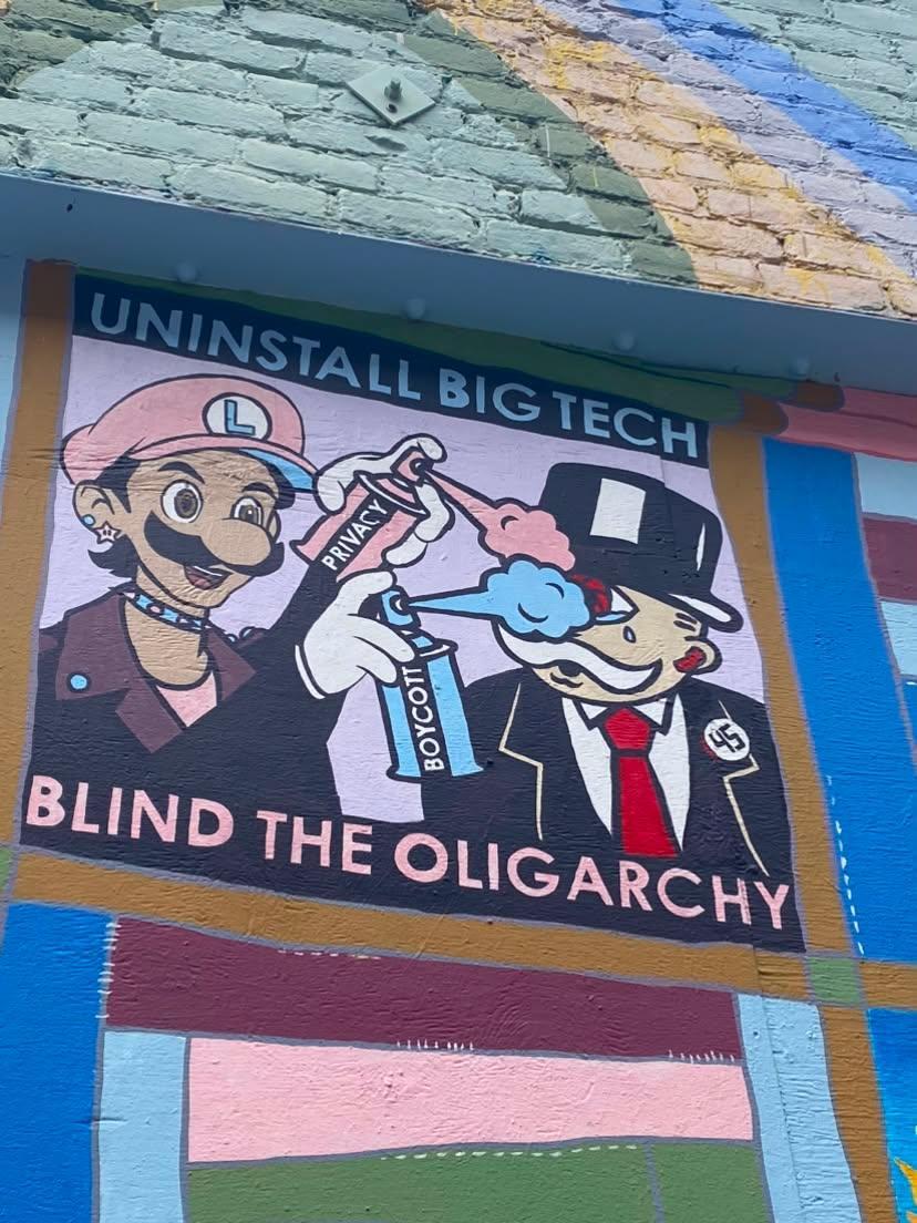 "Uninstall big tech. Blind the Oligarchy" Mural