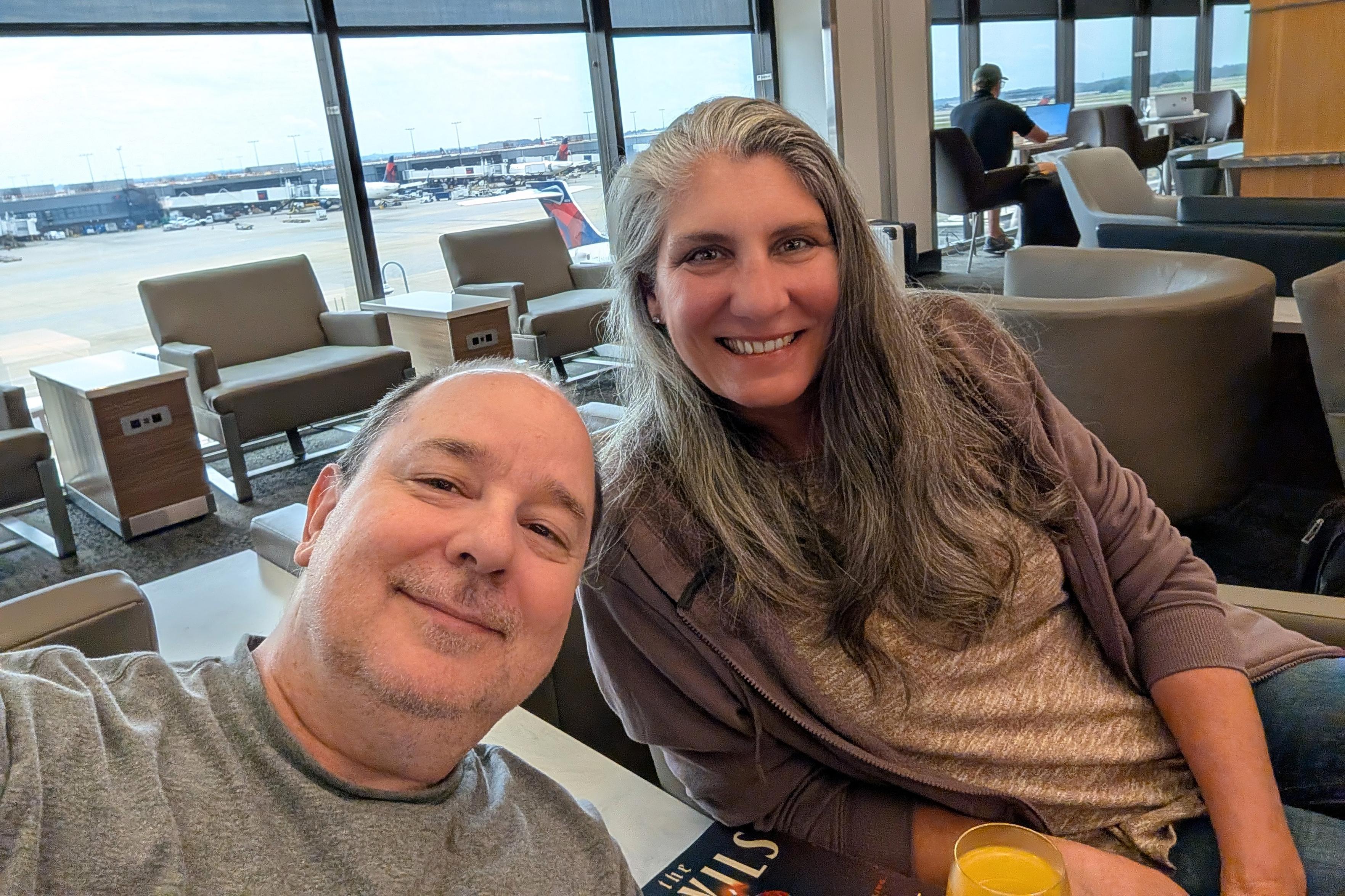 Krissy and I in the Sky Club in, I think, Atlanta. She looks fabulous. I look like a thumb.