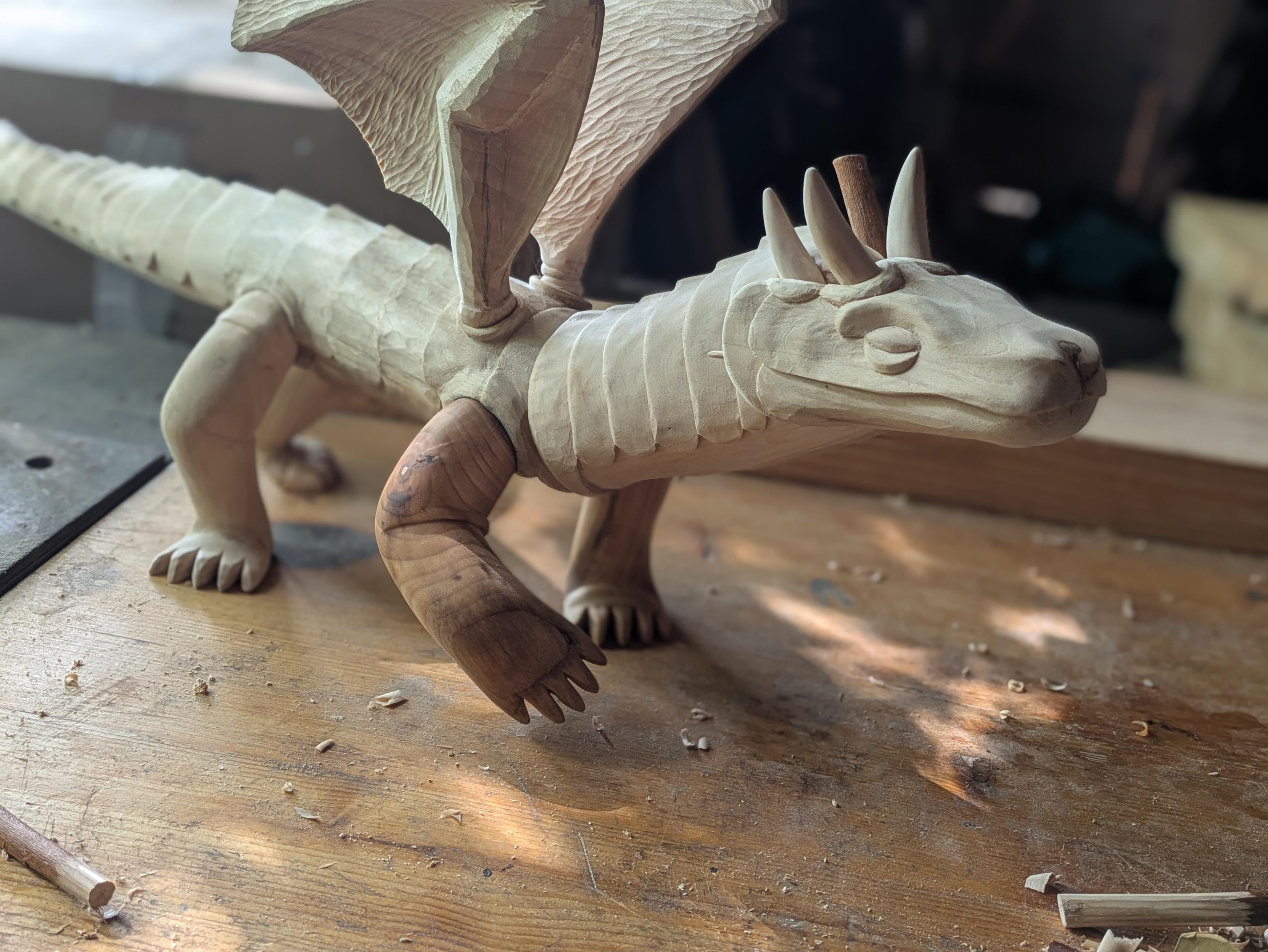 The draft, but now the dragon has 3 horns that are no longer sticks, the last one is still rough