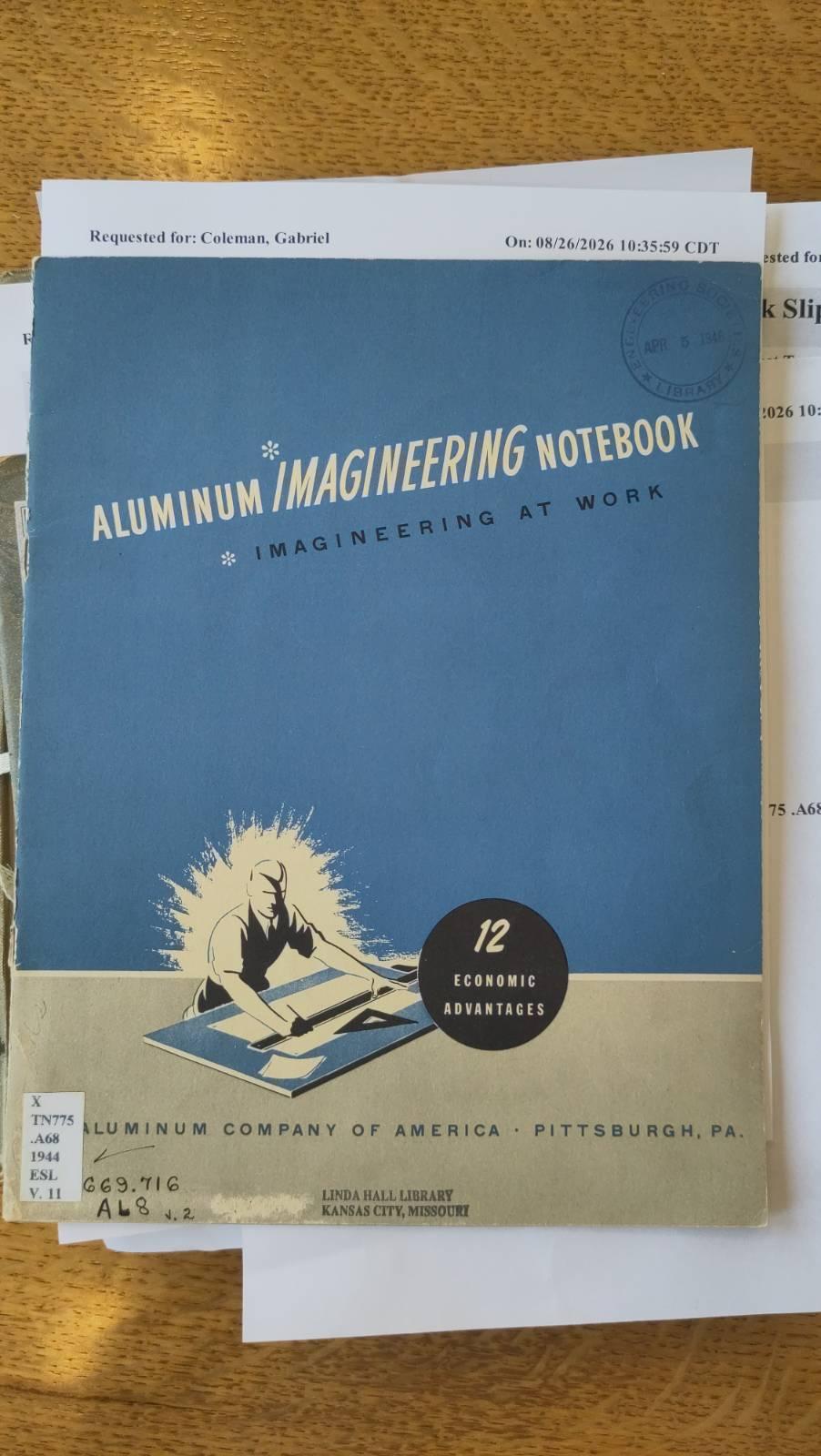 Cover of a blue and white pamphlet from 1942 titled "Aluminum Imagineering Notebook." The cover shows a graphic illustration of a male engineer working on a drafting board.
