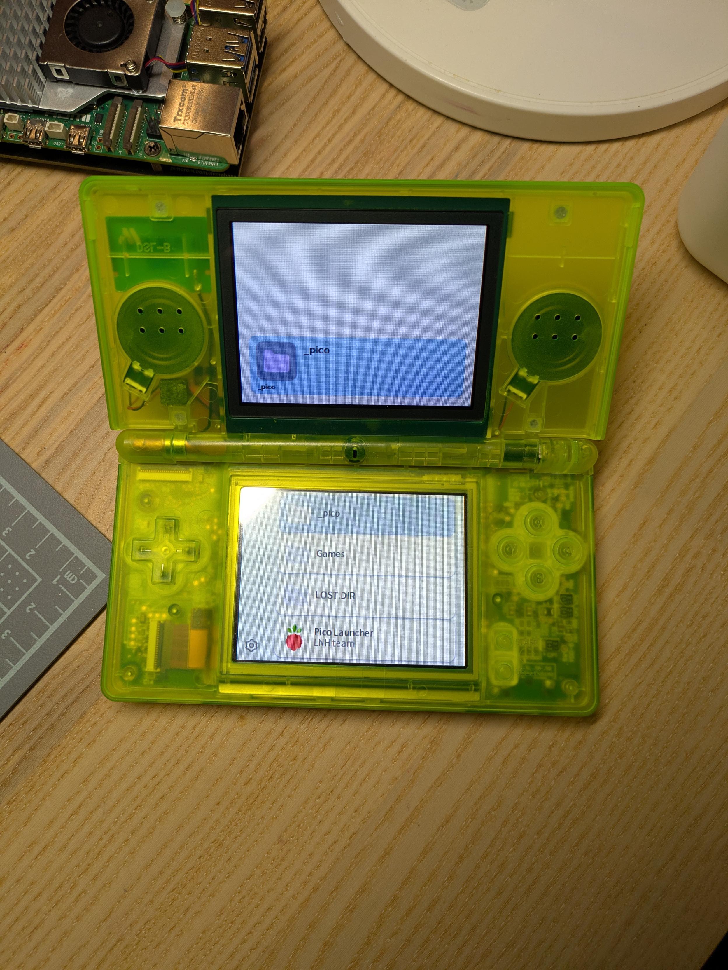 Nintendo DS Lite in Neon Green transparent case with DSPico launcher.