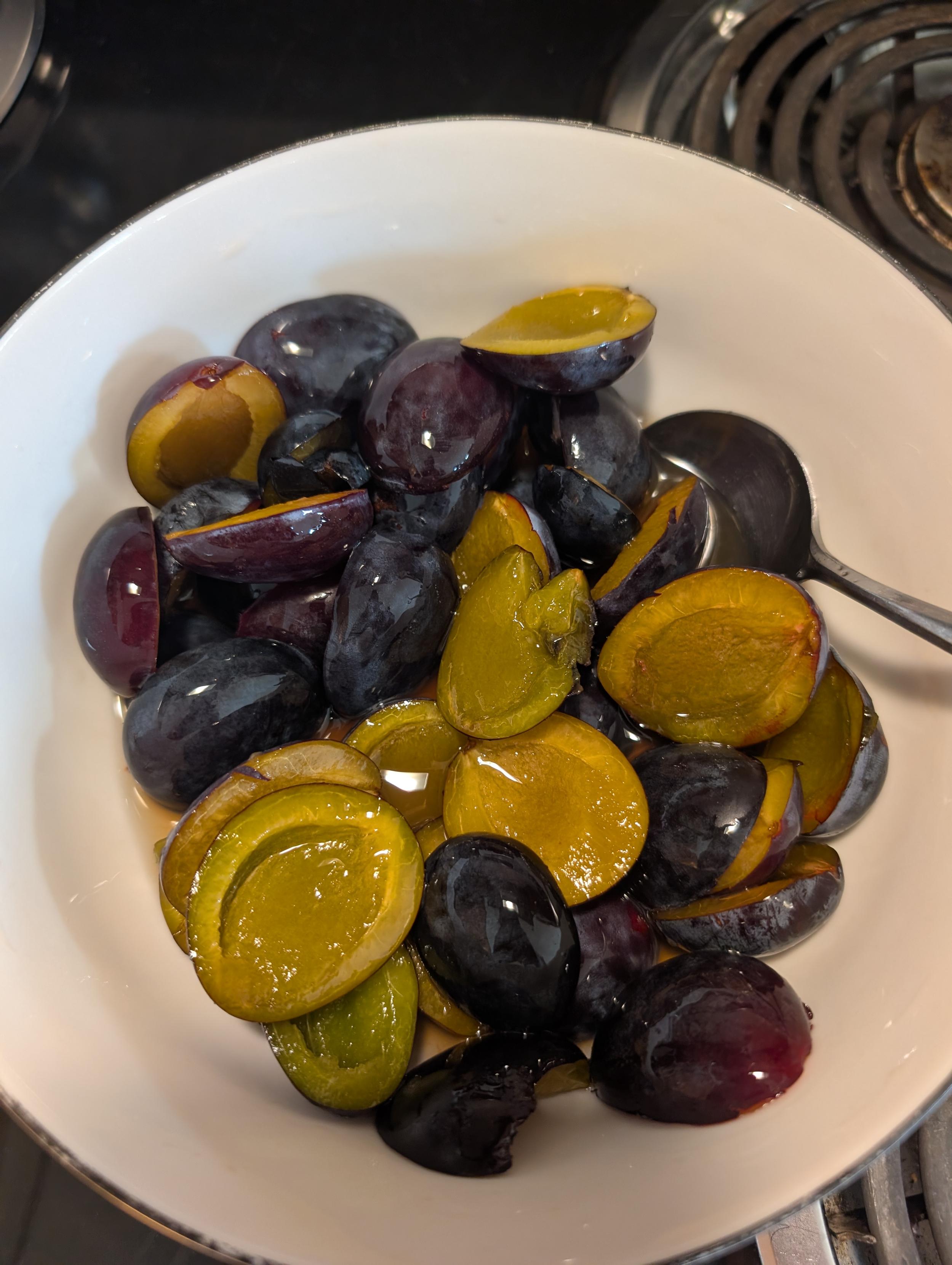 Plums soaking in an assortment of alcohol