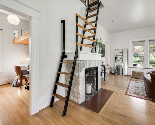 I can't say that I've seen this before. A ladder that goes across a mantelpiece, and a bunk bed with the ladde…