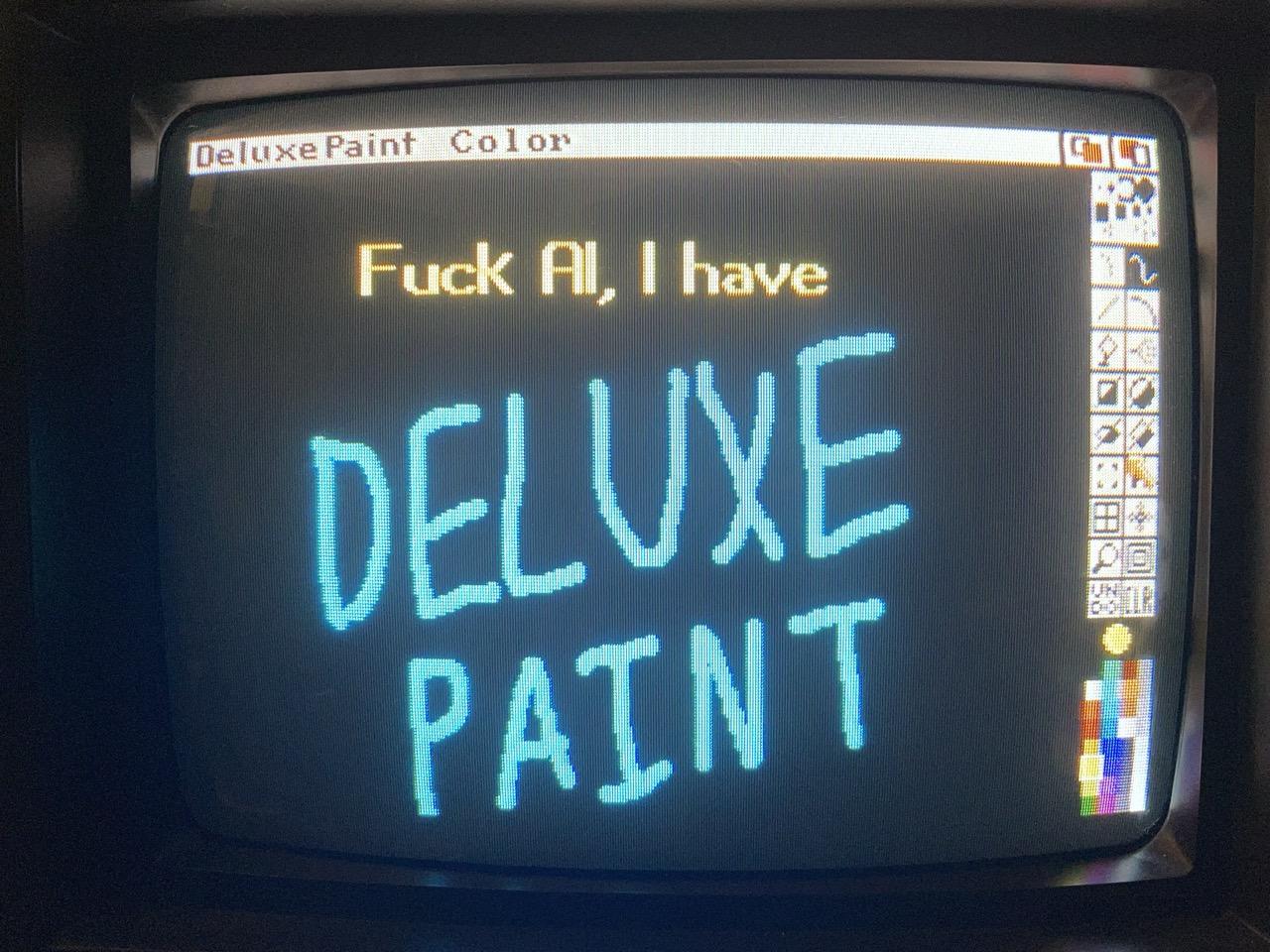 Deluxe Paint III on the Amiga. The drawing says “Fuck AI, I have Deluxe Paint.”