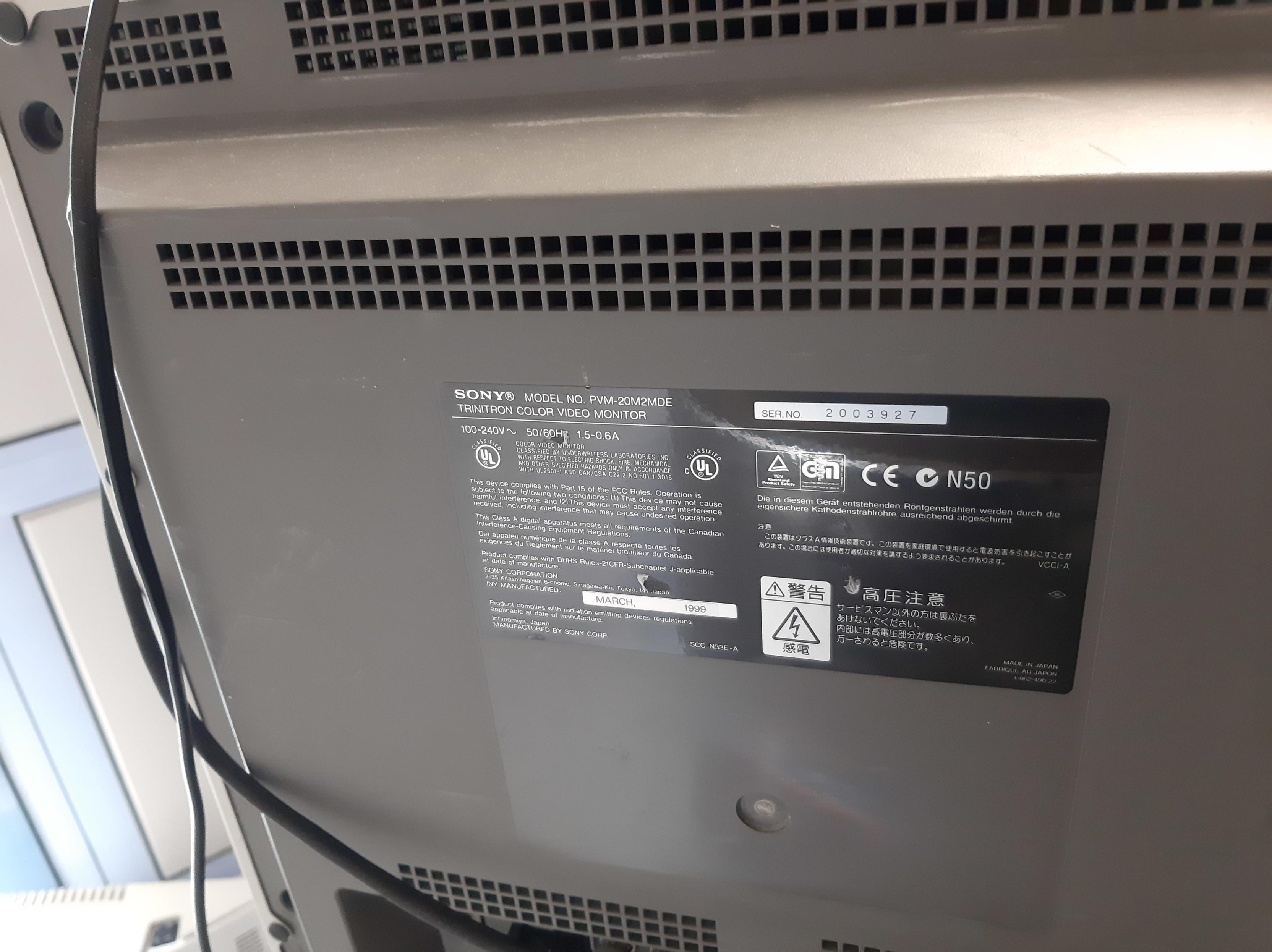 Back side of the CRT display. The device identification label is the main subject of the picture.