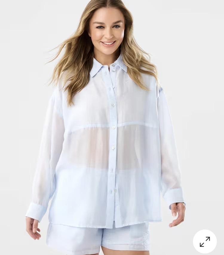 A long sleeve shirt in collared business button up style but it’s in semi see through mesh