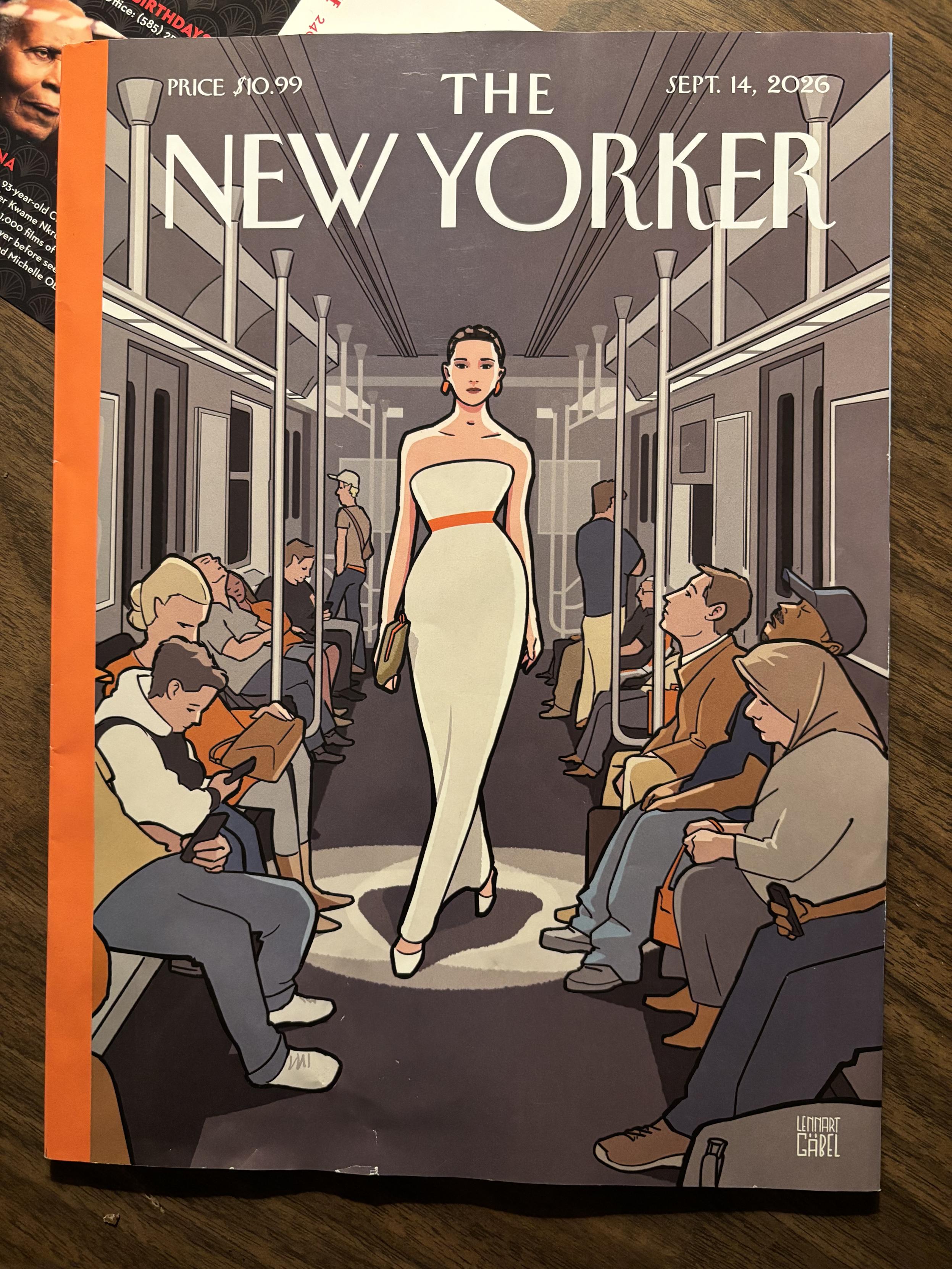 female model all dressed in white walking in a spotlight, as though on a fashion show runway but strutting through a subway car full of everyday people instead