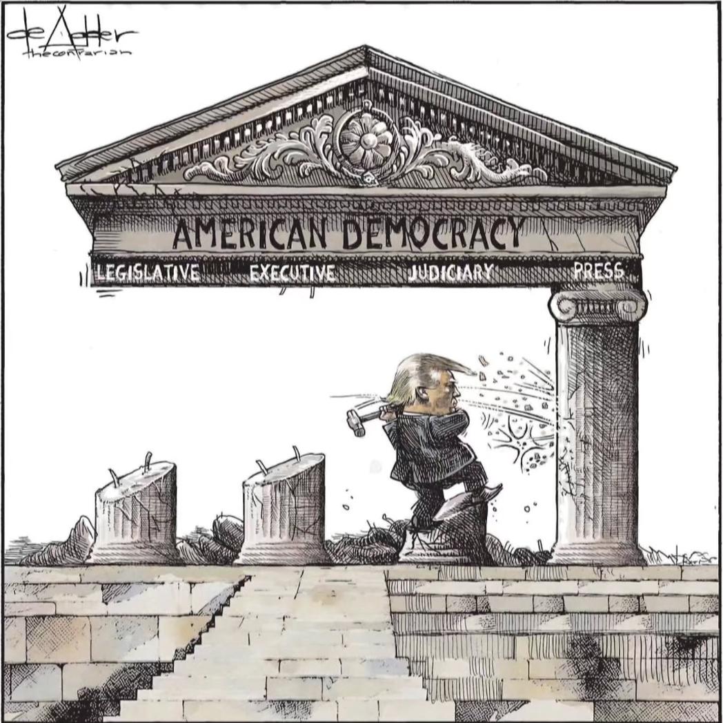 Cartoon. Trump is taking a sledgehammer to a stone Corinthian column labeled, “Press”, having already destroyed the 3 other columns labeled, “Legislative”, “Executive” & “Judiciary”. Atop the 4 columns is the pediment labeled, “American Democracy”. By Michael DeAdder.
