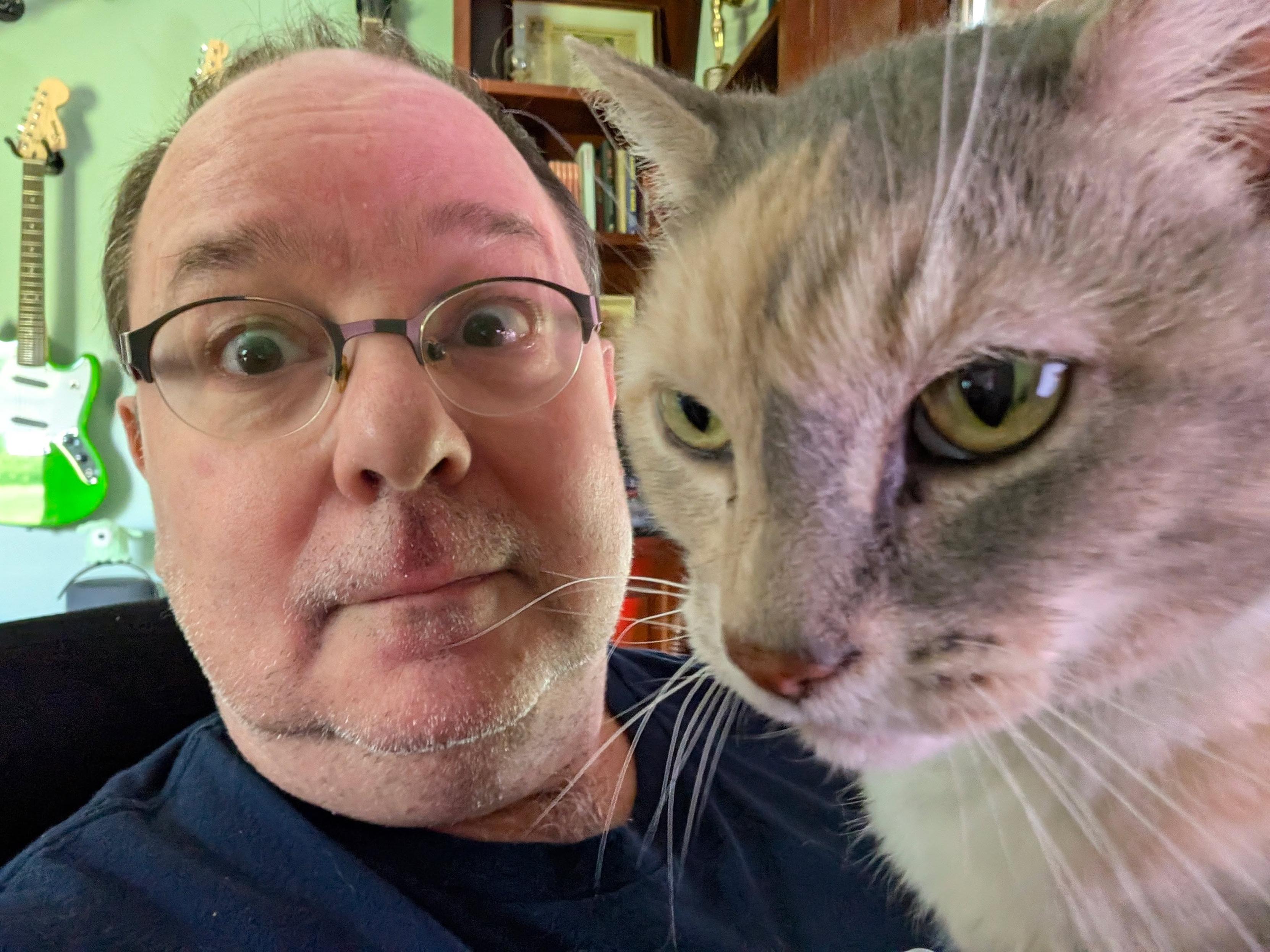 Me and Sugar the cat, who is clearly contemplating beating the crap out of me