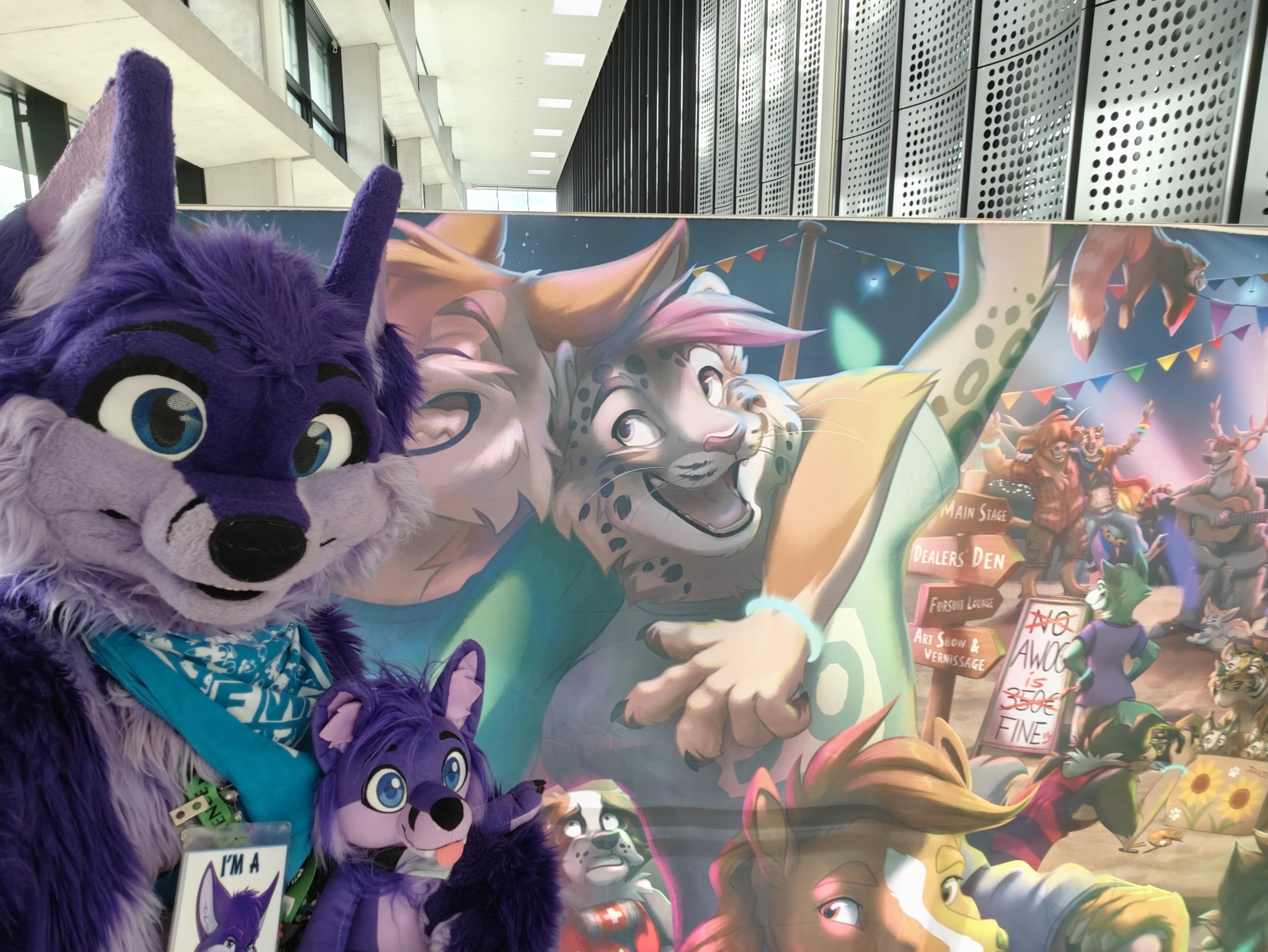 Niqnaq and Little Niq in front of a mural at Eurofurence. Drawn by TaniDaReal