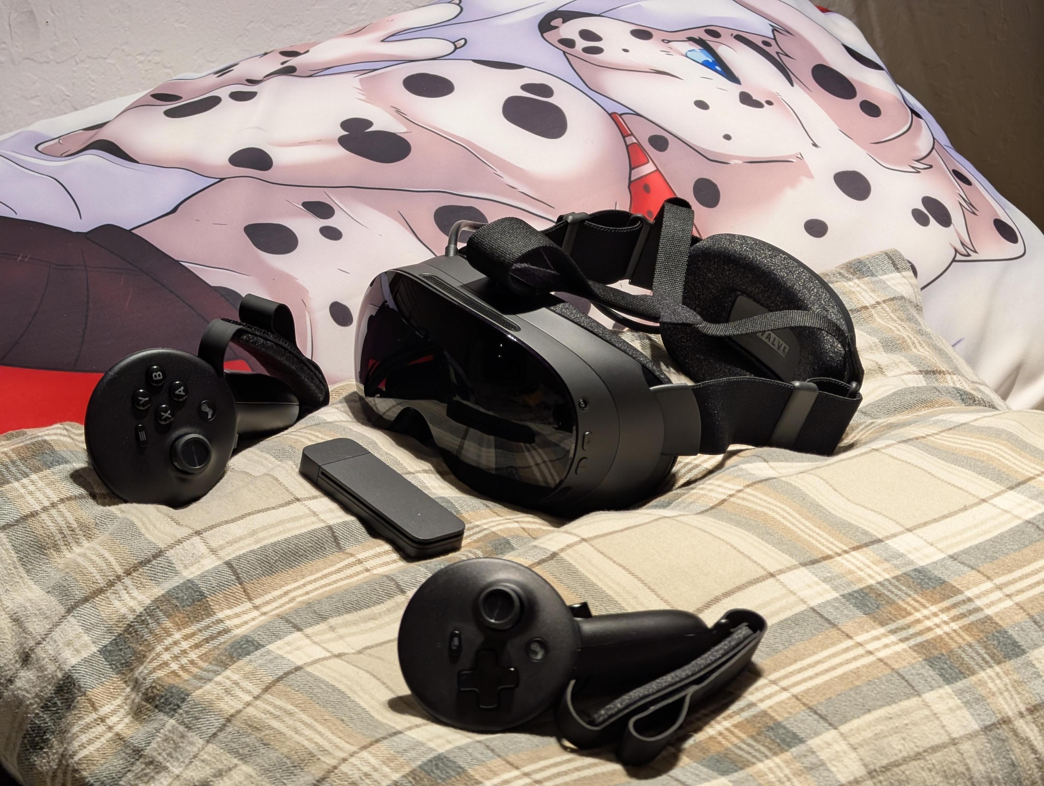 Picture of the Steam Frame, with a dalmatian furry daki in the background.