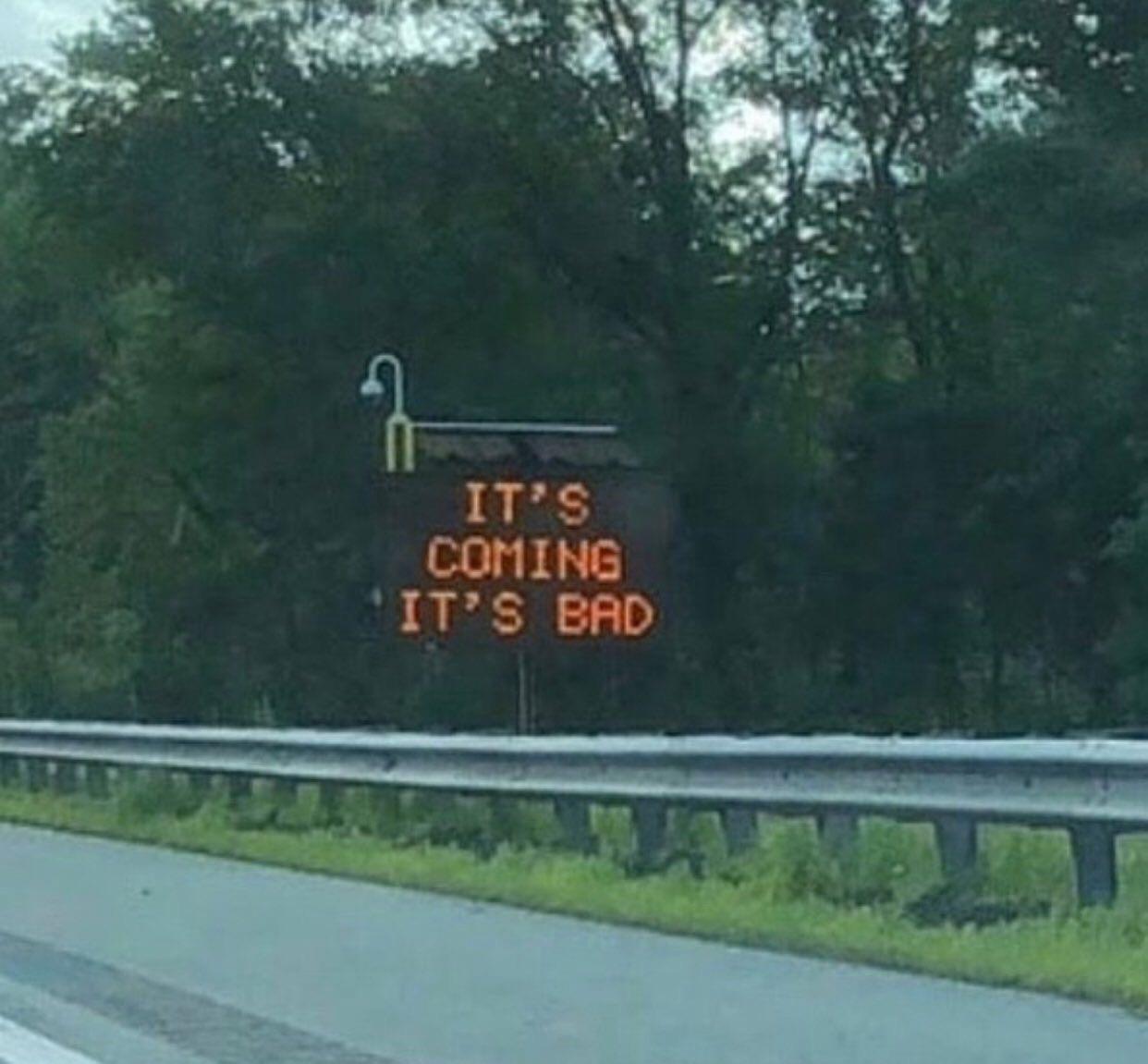 Roadside light up sign reading “It’s Coming. It’s Bad”