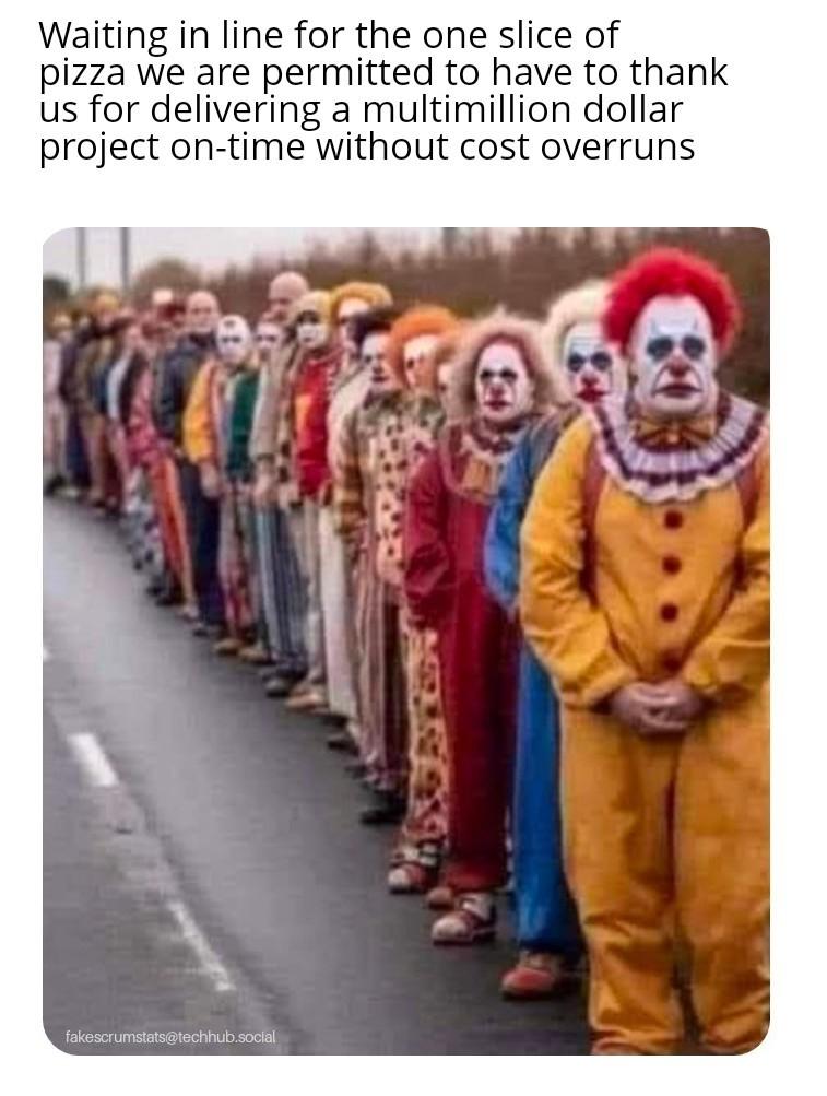 Photo of a line of clowns on the roadside Caption: Waiting in line for the one slice of pizza we are permitted to have to thank us for delivering a multimillio…