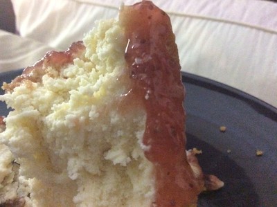 An amazing piece of strawberry-jam-glazed cheesecake.