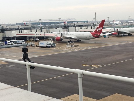 Virgin Atlantic plane sitting at the gate at Heathrow.