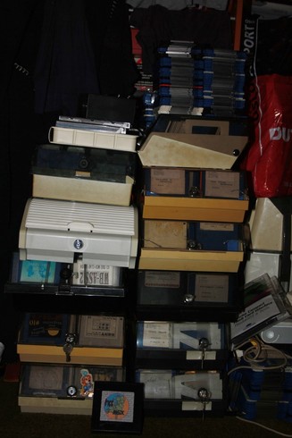 Stacks of 3½" floppy diskette boxes full of MSX (and possibly Amiga) software.