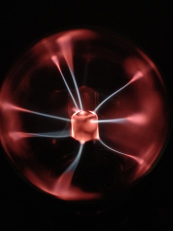 Close-up of a plasma globe hitting random targets on the glass dome.