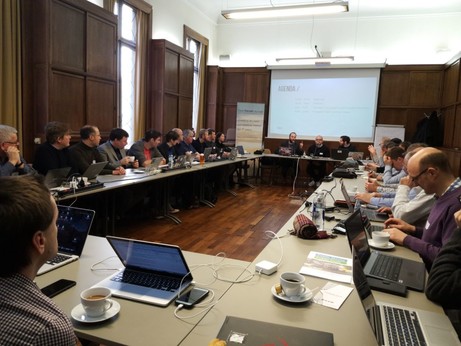 Representatives sitting in around a round table