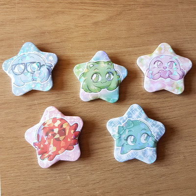 five multicoloured tin star badges with cute octopi designs on them