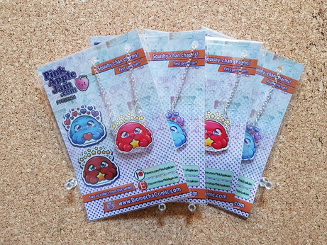 packs of acrylic charms of a cute red and blue octopi  designs on them, as necklaces on chains