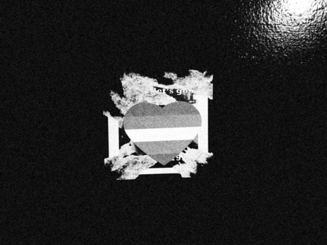 a trans pride sticker on the wall in the entrance of smartbar