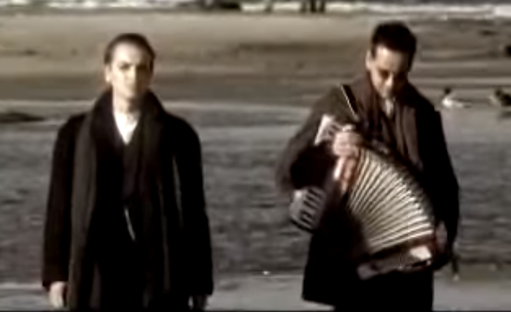 The two musicians of Wolfsheim, one carrying an accordion.