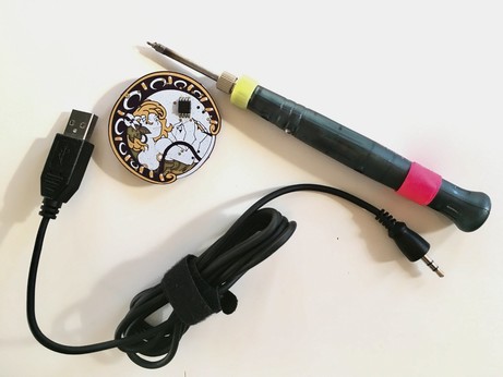 A USB-A to 1/8" headphone jack powered soldering iron with a small surface mount soldering kit